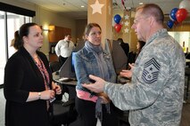 Tamara Hawes, Director of Community Relations, and Kelly Geers, District Director, both with the office of Representative Michael Turner of Ohio’s 10th District, talk with Air Force Reserve Chief Master Sgt. Steven Larwood, 910th Airlift Wing Command Chief, following a Congressional Flight, April 10, 2015. Staff personnel from the offices of four members of Ohio’s U.S. House of Representatives delegation and Ohio’s senior U.S. Senator participated in the flight which departed from and returned to here. According to Department of Defense (DoD) regulations, these flights are held in the best interest of DoD, Air Force (AF) and Air Force Reserve Command (AFRC) public affairs objectives and the invited congressional members or staffers can make positive contributions to the public's understanding of the roles and missions of the DoD, AF and AFRC. Click on the following link for more on the new USO Lounge at YARS: http://www.youngstown.afrc.af.mil/News/ArticleDisplay/tabid/822/Article/584806/910th-uso-cut-ribbon-on-new-yars-lounge.aspx  (U.S. Air Force photo/Master Sgt. Bob Barko Jr.)
