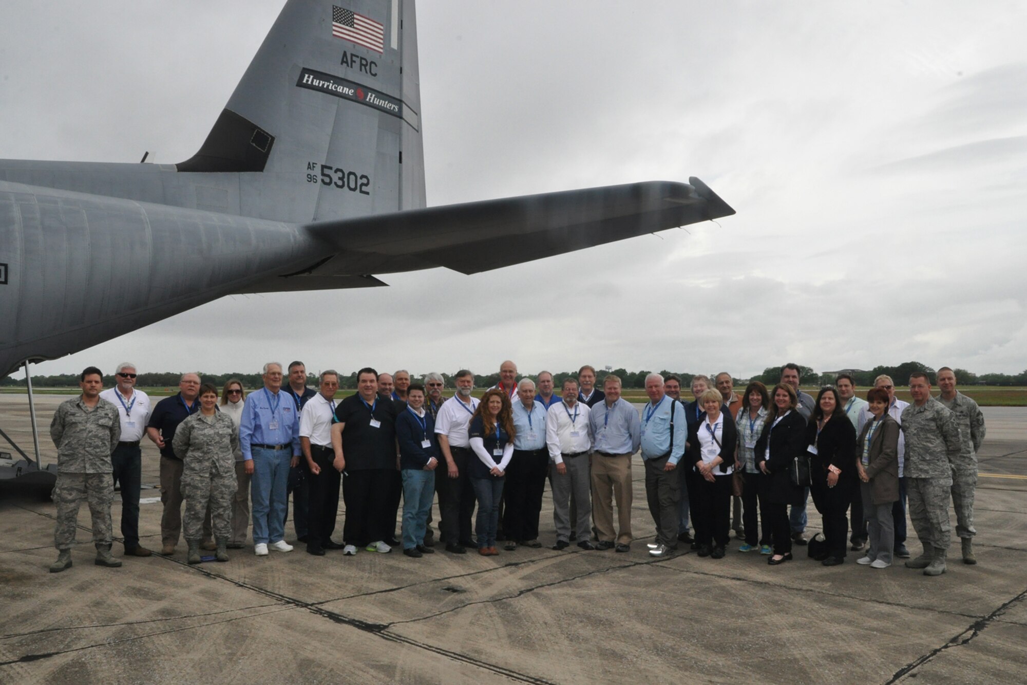 A group of 31 civic leaders and their military escorts, all participants in the 910th Airlift Wing’s Civic Leader Tour 2015 originating from Youngstown Air Reserve Station, Ohio, stand in front of a WC-130J aircraft on the flightline here, April 15, 2015. A walkthrough of the WC-130J, assigned to the 53rd Weather Reconnaissance Squadron Hurricane Hunters, was part of the itinerary of the two-day, one-night event, held April 15-16, 2015, designed to give attendees a better understanding of the Air Force Reserve mission and how it differs from base to base around the country. (U.S. Air Force photo/Master Sgt. Bob Barko Jr.)