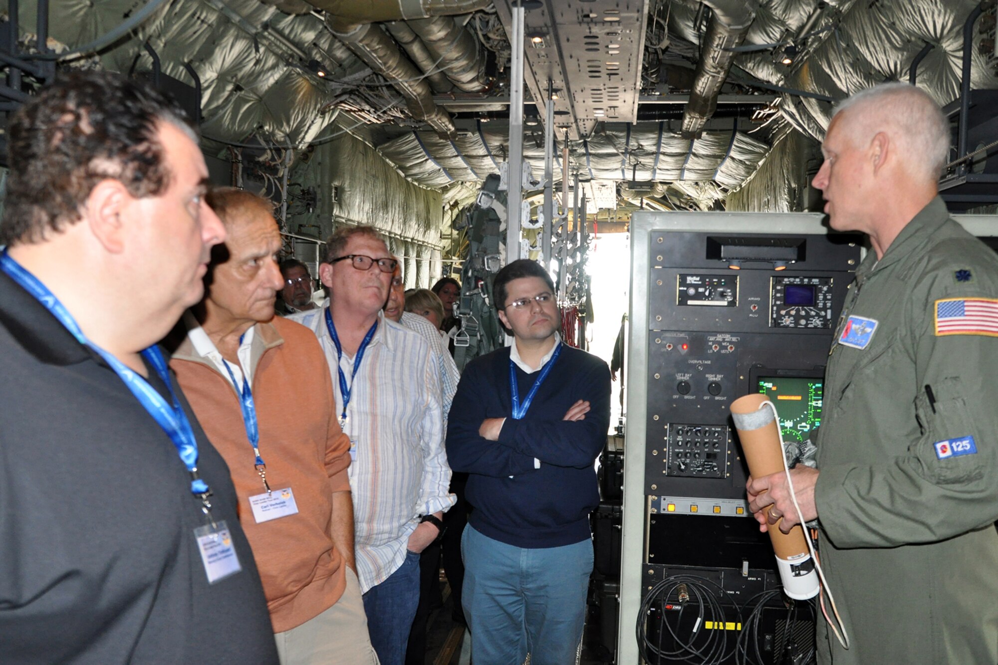 KEESLER AIR FORCE BASE, Mississippi—Air Force Reserve Lt. Col. Jon Talbot (right), 53rd Weather Reconnaissance Squadron Hurricane Hunters aerial reconnaissance weather officer, talks with a group of civic leaders on the cargo deck of one of the unit’s WC-130J aircraft on the flightline here, April 15, 2015. A walkthrough of the WC-130J was part of the itinerary of the 910th Airlift Wing’s Civic Leader Tour 2015 originating from Youngstown Air Reserve Station, Ohio. A group of 31 civic leaders and their military escorts, attended the two-day, one-night event, designed to give them a better understanding of the Air Force Reserve mission and how it differs from base to base around the country. (U.S. Air Force photo/Master Sgt. Bob Barko Jr.)