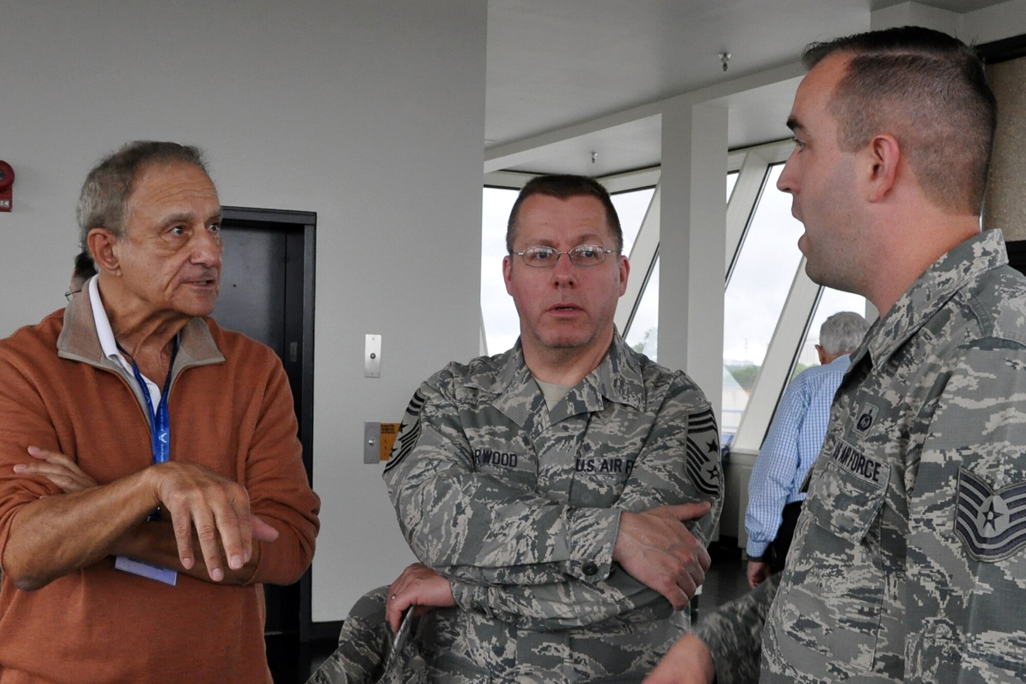 Mr. Carl Verholek, a retired civic leader from Sharpsville, Pennsylvania and Air Force Reserve Chief Master Sgt. Steve Larwood (center), 910th Airlift Wing command chief, talk with an instructor (right) on the observation level of the weather schoolhouse here, April 15, 2015. A visit to the school house and a briefing about the Air Force meteorology training course was part of the itinerary of the 910th Airlift Wing’s Civic Leader Tour 2015 originating from Youngstown Air Reserve Station, Ohio. A group of 31 civic leaders and their military escorts attended the two-day, one-night event, designed to give them a better understanding of the Air Force Reserve mission and how it differs from base to base around the country. U.S. Air Force photo by Master Sgt. Bob Barko Jr.
