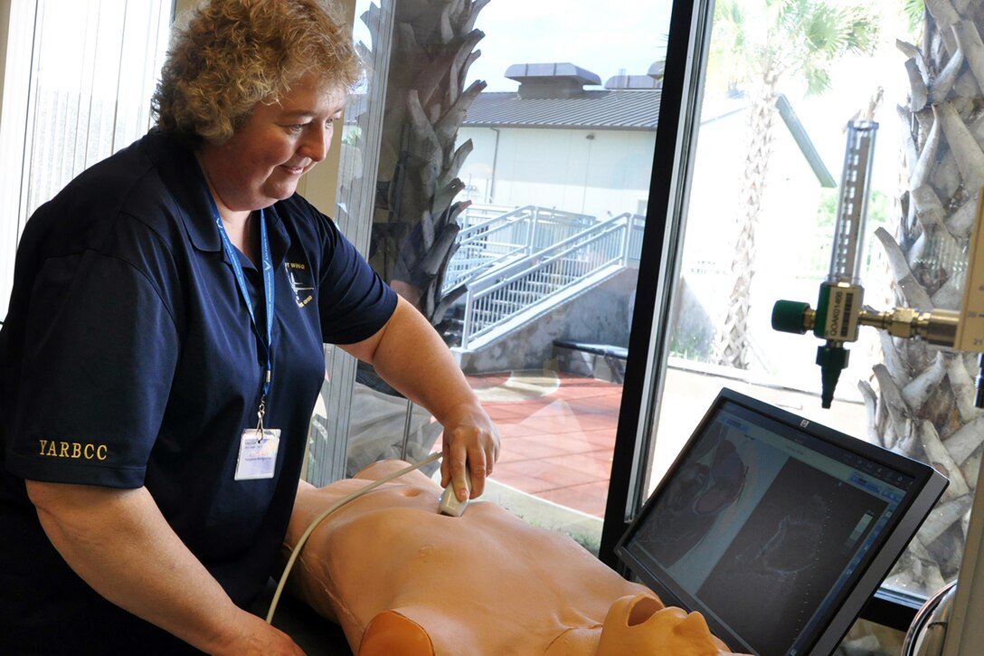 Brenda Rider, a baliff with the Youngstown Municipal Court and resident of North Jackson, Ohio tries her hand with a medical imaging device on a mannequin at the Keesler Medical Center here, April 15, 2015. The visit to the medical center and a briefing about the Air Force medical training course was part of the itinerary of the 910th Airlift Wing’s Civic Leader Tour 2015 originating from Youngstown Air Reserve Station, Ohio. A group of 31 civic leaders and their military escorts, attended the two-day, one-night event, designed to give them a better understanding of the Air Force Reserve mission and how it differs from base to base around the country. (U.S. Air Force photo/Master Sgt. Bob Barko Jr.)