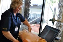 Brenda Rider, a baliff with the Youngstown Municipal Court and resident of North Jackson, Ohio tries her hand with a medical imaging device on a mannequin at the Keesler Medical Center here, April 15, 2015. The visit to the medical center and a briefing about the Air Force medical training course was part of the itinerary of the 910th Airlift Wing’s Civic Leader Tour 2015 originating from Youngstown Air Reserve Station, Ohio. A group of 31 civic leaders and their military escorts, attended the two-day, one-night event, designed to give them a better understanding of the Air Force Reserve mission and how it differs from base to base around the country. (U.S. Air Force photo/Master Sgt. Bob Barko Jr.)