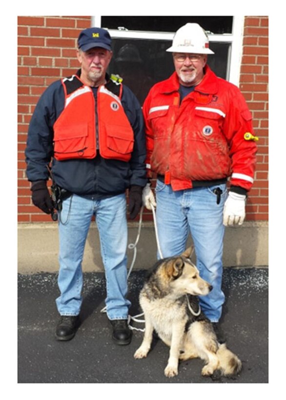 Wayne Adams (left) and Alan Craigmyle rescued Lucky the husky at Markland Locks and Dam, Warsaw, Ky.