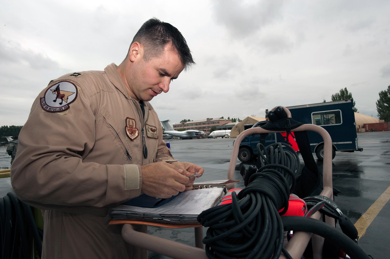 Capt. Tyson Frost, deployed from the Washington Air National Guard's 141st Air Refueling Wing, prepares for his his 100th combat sortie Sept. 18, 2010.