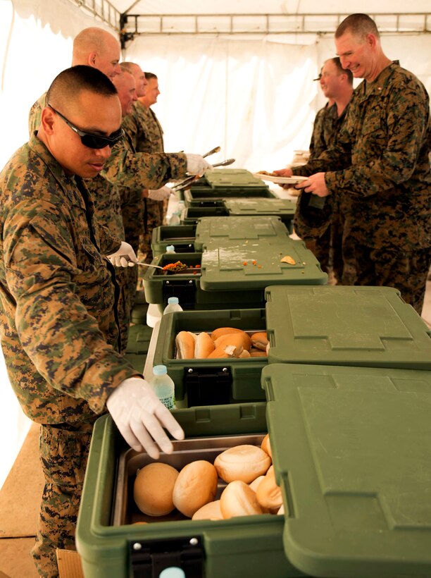 Sgt. Major Vincent C. Santiago serves lunch with other senior leadership to Marines after the final U.S. Marine Corps training event of exercise Balikatan in Crow Valley, April 27. The last U.S. Marine Corps event of Balikatan involved cross-training and interoperability field-training exercises. This was the 31st iteration of Balikatan, the annual interoperability exercise with the U.S. military and the Armed Forces of the Philippines. Santiago, from Merizo, Guam, is the Sergeant Major for 3rd Marine Regiment, 3rd Marine Division, III Marine Expeditionary Force.