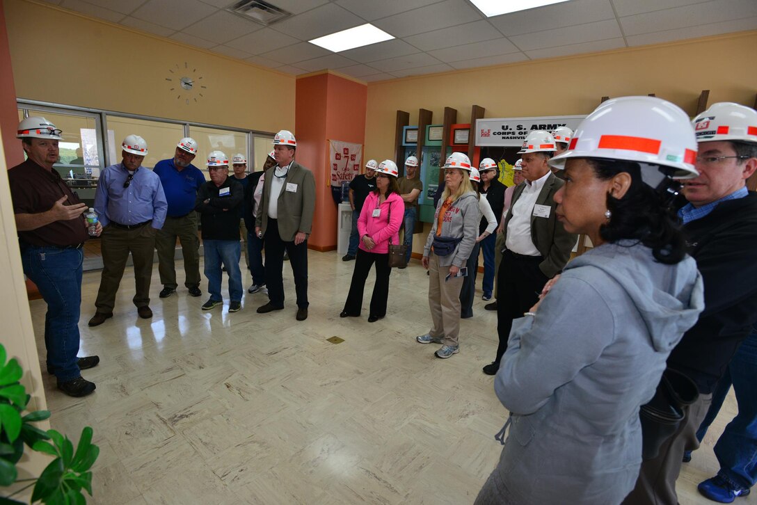 Steven Crawford, a Hydropower Trainee,  from the Old Hickory power plant, explains to a group from the Federal Utility Partnership Working group how water passes through generating units using a gravity-fed system at Old Hickory Dam in Hendersonville, Tenn., Thursday, April 23, 2015.