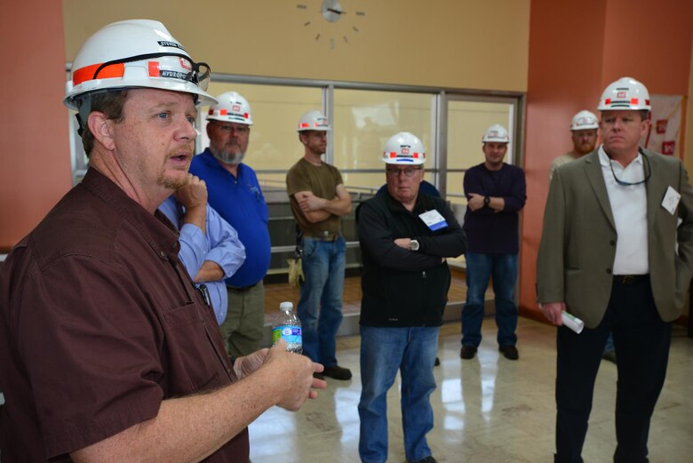 Steven Crawford, a Hydropower Trainee at the Old Hickory power plant briefs a group from the Federal Utility Partnership Working group on safety hazards around the dam in Hendersonville, Tenn., April 23, 2015.