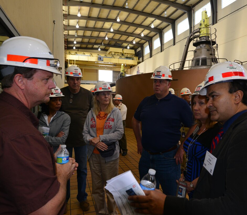 Steven Crawford, hydropower trainee from the Old Hickory Power Plant talks with a group of the country’s top power brokers during a tour.  