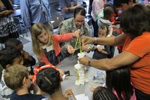 Team Bravo students build Corps marshmallow tower with assistance from Sgt. 1st Class Betsy Weintraub and Lanita Bonds, Installation Support and Programs Management Directorate.
