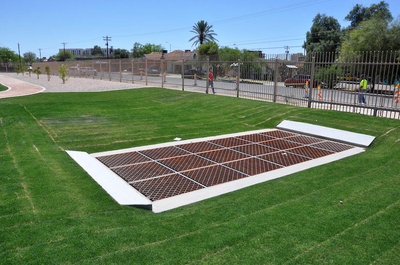 The inlet of the box culvert sits ready for the next storm at the southwest end of Tucson High School where officials celebrated completion of the final phase of the Tucson Drainage Area/Arroyo Chico Multi-use Project April 16. The $5 million segment was completed in 11 months and will greatly reduce flood risk for more than 1,000 residential, commercial and industrial structures with an assessed value of over $300 million.