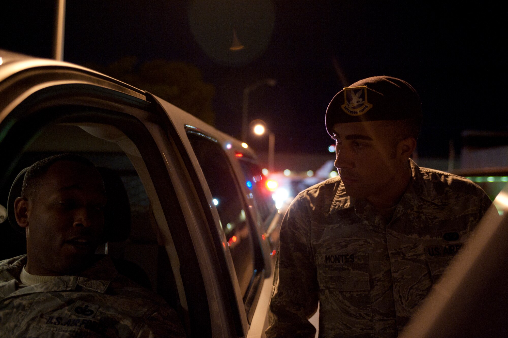 Senior Airman Daniel Montes, 99th Security Forces Squadron patrol leader, questions a role player during a drunk driver training exercise at Nellis Air Force Base, Nev., April 27, 2015. Junior 99th SFS members are frequently tested by senior members on how to respond to multiple scenarios they could encounter in the field. (U.S. Air Force photo by Staff Sgt. Siuta B. Ika)