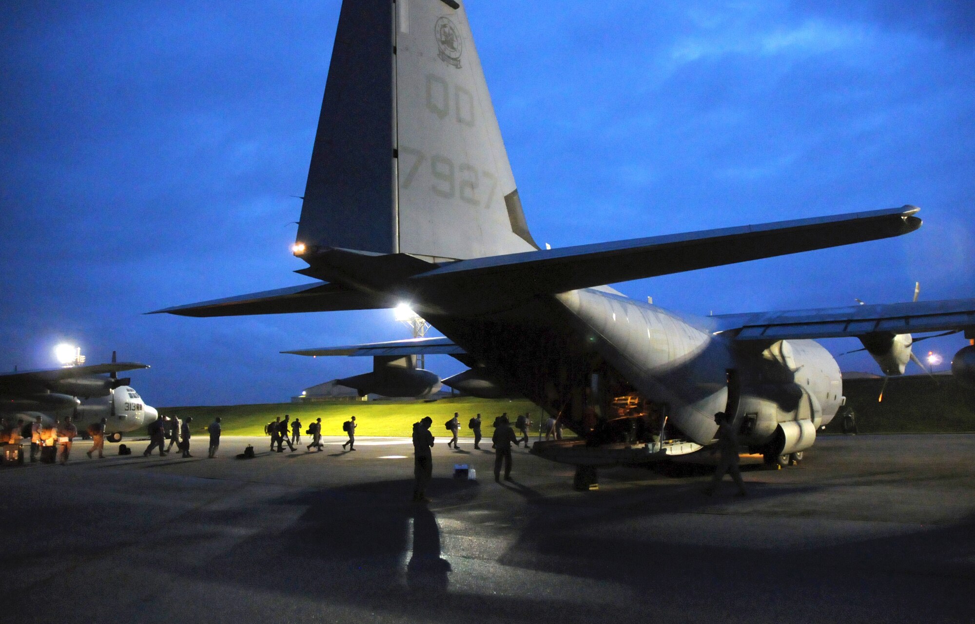 Members of a U.S. Pacific Command Joint Humanitarian Assistance Survey Team load onto a U.S. Marine Corps C-130 at Kadena Air Base, Japan, on April 29, 2015. The team is deploying to Nepal to assist earthquake relief efforts. Kadena’s Airmen worked through the night to load the team’s 20-plus members and gear for the departure. (U.S. Air Force photo by 2nd Lt. Erik Anthony)