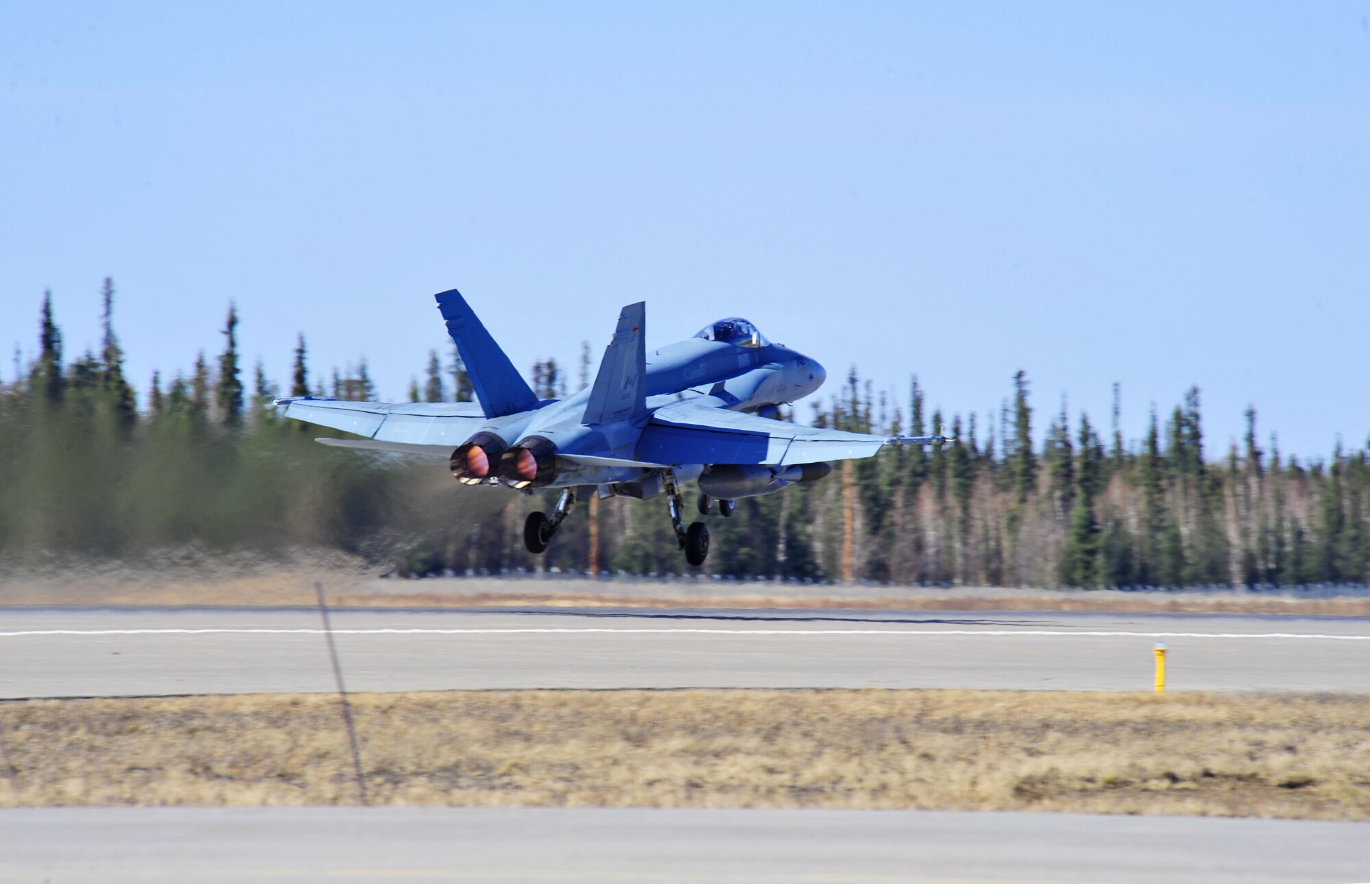 A CF-18 Hornet aircraft assigned to the Royal Canadian Air Force's 425th Tactical Fighter Squadron takes off for an afternoon mission April 28, 2015, during Distant Frontier at Eielson Air Force Base, Alaska.  Distant Frontier is a preparation period during which RED FLAG-Alaska participants familiarize themselves with the airspace. (U.S. Air Force photo by Tech. Sgt. Miguel Lara III/Released)