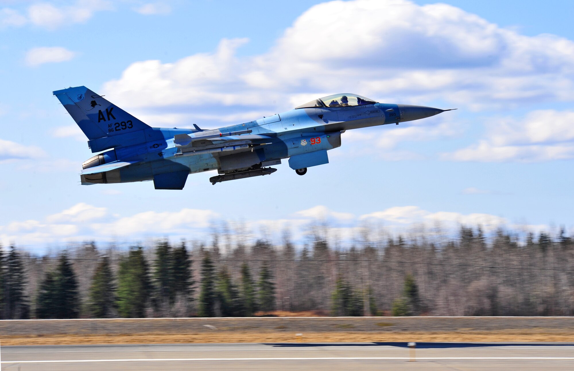 An F-16 Fighting Falcon aircraft assigned to the 18th Aggressor Squadron takes off for an afternoon mission April 28, 2015, during Distant Frontier at Eielson Air Force Base, Alaska.  Aggressor pilots are trained to act as opposing forces in RED FLAG-Alaska to prepare U.S. and allied forces for real-world aerial combat. (U.S. Air Force photo by Tech. Sgt. Miguel Lara III/Released)