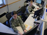 Senior Airmen Allisha Pittenger, left, Stephanie Wolf, center, and Samantha Sponsler, 341st Comptroller Squadron customer service technicians, work at the customer service desk in Building 1191 April 29, 2015, at Malmstrom Air Force Base, Mont. CSTs strive to provide excellent customer service to Team Malmstrom members to make their trip to the finance office as easy as possible. (U.S. Air Force photo/Airman 1st Class Dillon Johnston)