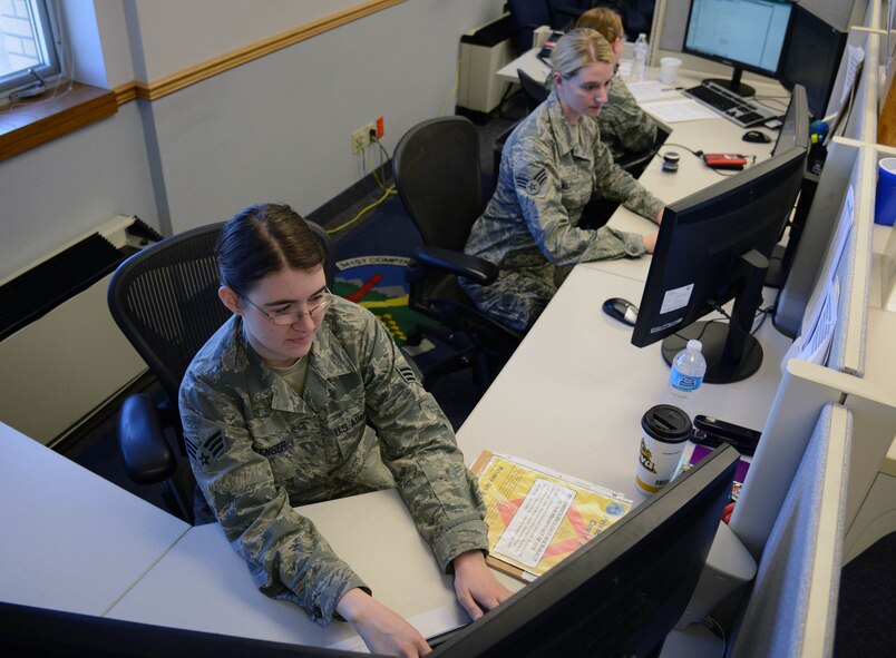 Senior Airmen Allisha Pittenger, left, Stephanie Wolf, center, and Samantha Sponsler, 341st Comptroller Squadron customer service technicians, work at the customer service desk in Building 1191 April 29, 2015, at Malmstrom Air Force Base, Mont. CSTs strive to provide excellent customer service to Team Malmstrom members to make their trip to the finance office as easy as possible. (U.S. Air Force photo/Airman 1st Class Dillon Johnston)