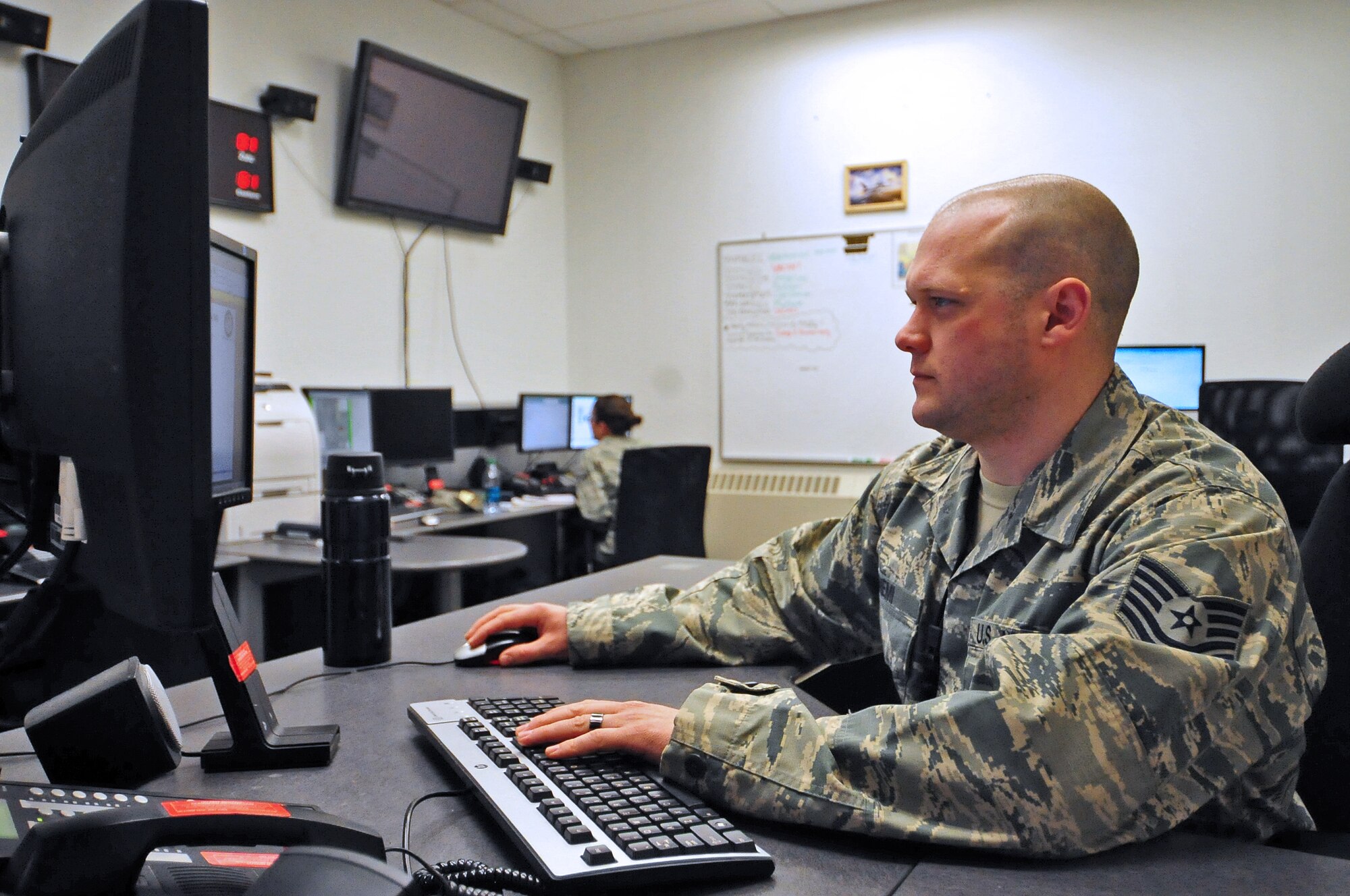U.S. Air Force Tech. Sgt. Matthew Niemi, a 354th Maintenance Group maintenance operations center (MOC) senior controller, reviews a maintenance schedule April 28, 2015, during Distant Frontier at Eielson Air Force Base, Alaska.  During missions like Distant Frontier, the MOC coordinates and monitors all maintenance and flying operations of the flightline. (U.S. Air Force photo by Tech. Sgt. Miguel Lara III/Released)