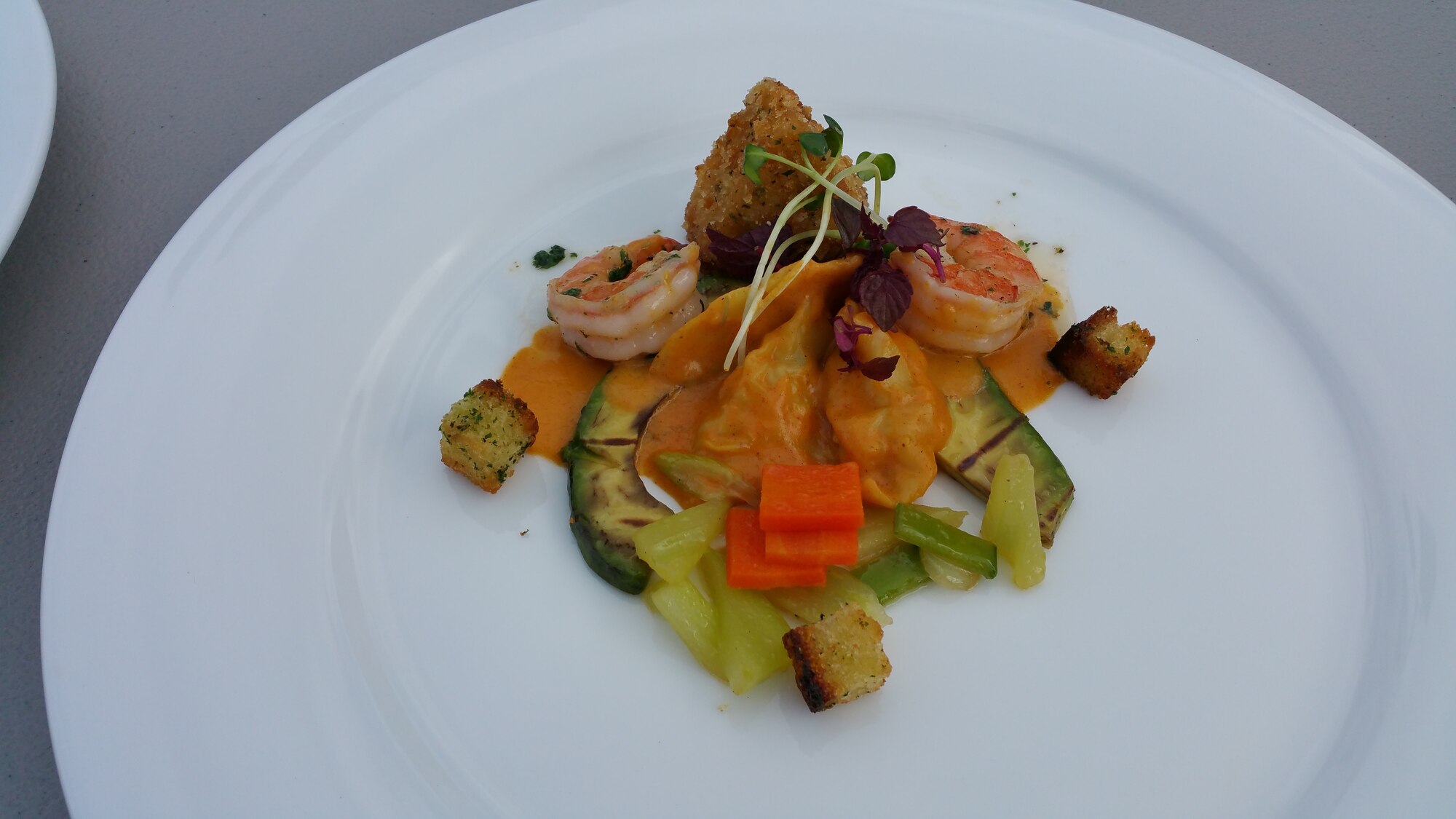 Butter sautéed shrimp, seafood pot stickers, classically cut vegetables, crispy polenta with a mild red coconut curry sauce prepared by the Joint Team Hawaii for the Military Culinary Arts Competitive Training Event in Fort Lee, Virginia March 11 2015. (Photo courtesy of Staff Sgt. Sheryl Stewart)