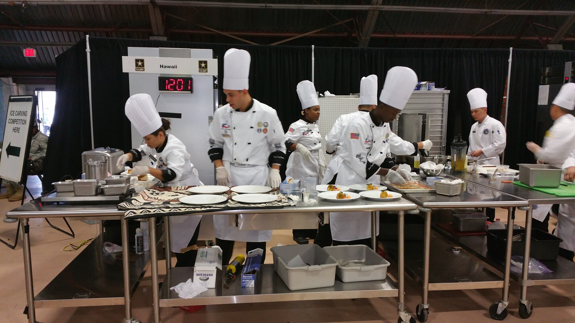 Members of the student team from the Joint Team Hawaii prepare their dishes during the Military Culinary Arts Competitive Training Event in Fort Lee, Virginia, March 11, 2015. The competition included 281 military chefs preparing 588 entries, earning 62 gold, 179 silver and 191 bronze medals.(Photo courtesy of Staff Sgt. Sheryl Stewart)