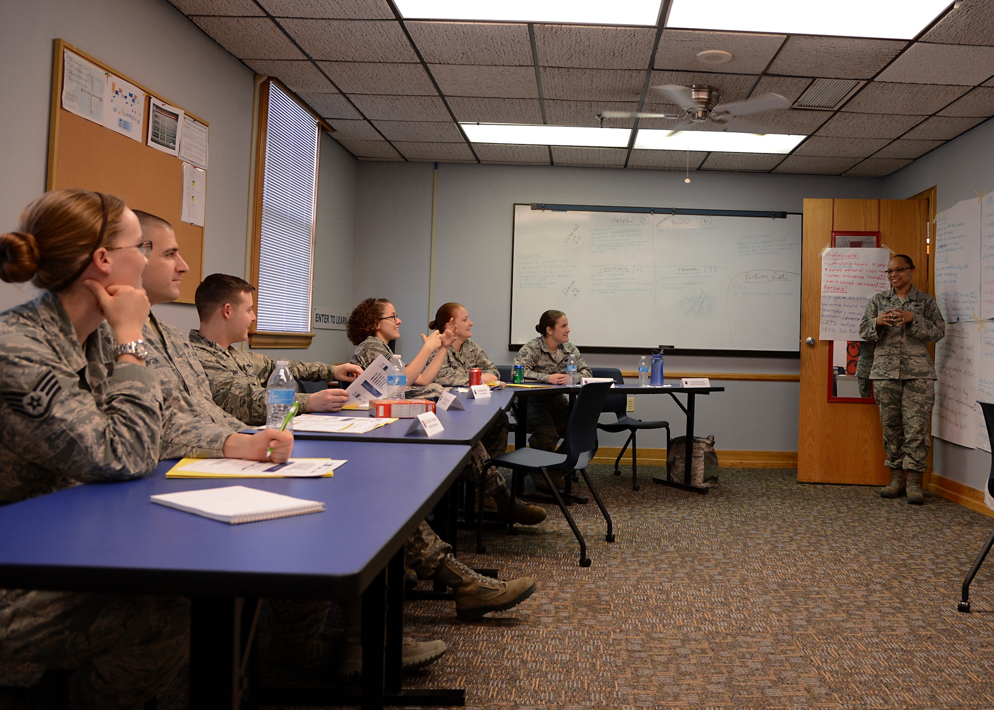 Tech. Sgt. Gina Scott, 90th Missile Wing Security Forces Squadron NCO in-charge of resource protection, F.E. Warren Air Force Base, Wyoming, discusses ways to help foster a more resilient Air Force with her team members on Barksdale Air Force Base, La., April 1, 2015. Around 20 Airmen from Air Force Global Strike Command, numbered air forces and wings, formed a Resiliency Tiger Team here. (U.S. Air Force photo/Senior Airman Joseph A. Pagán Jr.)