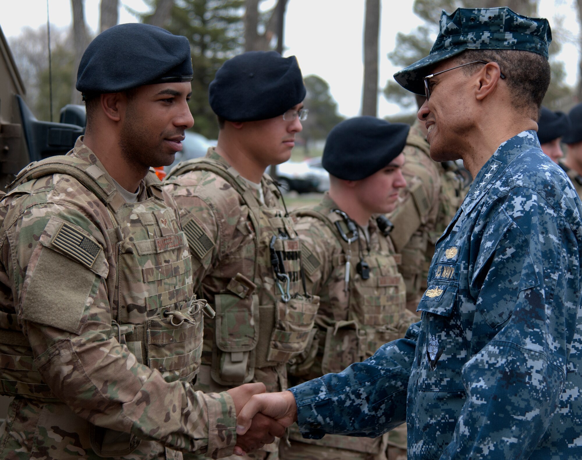 U.S. Navy Adm. Cecil D. Haney, U.S. Strategic Command commander, shakes hands with Senior Airman Shaan Shaffeeullah, 790th Missile Security Forces Squadron convoy response force member, during a visit to F.E. Warren Air Force Base, Wyo., April 28, 2015. Haney traveled to F.E. Warren to see firsthand the men and women performing the ICBM mission 24/7, 365, and to chair the Intercontinental Ballistic Missile Stakeholders meeting, one of several such meetings that will be held this year. USSTRATCOM is one of nine DoD unified combatant commands and is charged with strategic deterrence; space operations; cyberspace operations; joint electronic warfare; global strike; missile defense; intelligence, surveillance and reconnaissance; combating weapons of mass destruction; and analysis and targeting. (U.S. Air Force photo by Airman 1st Class Brandon Valle)