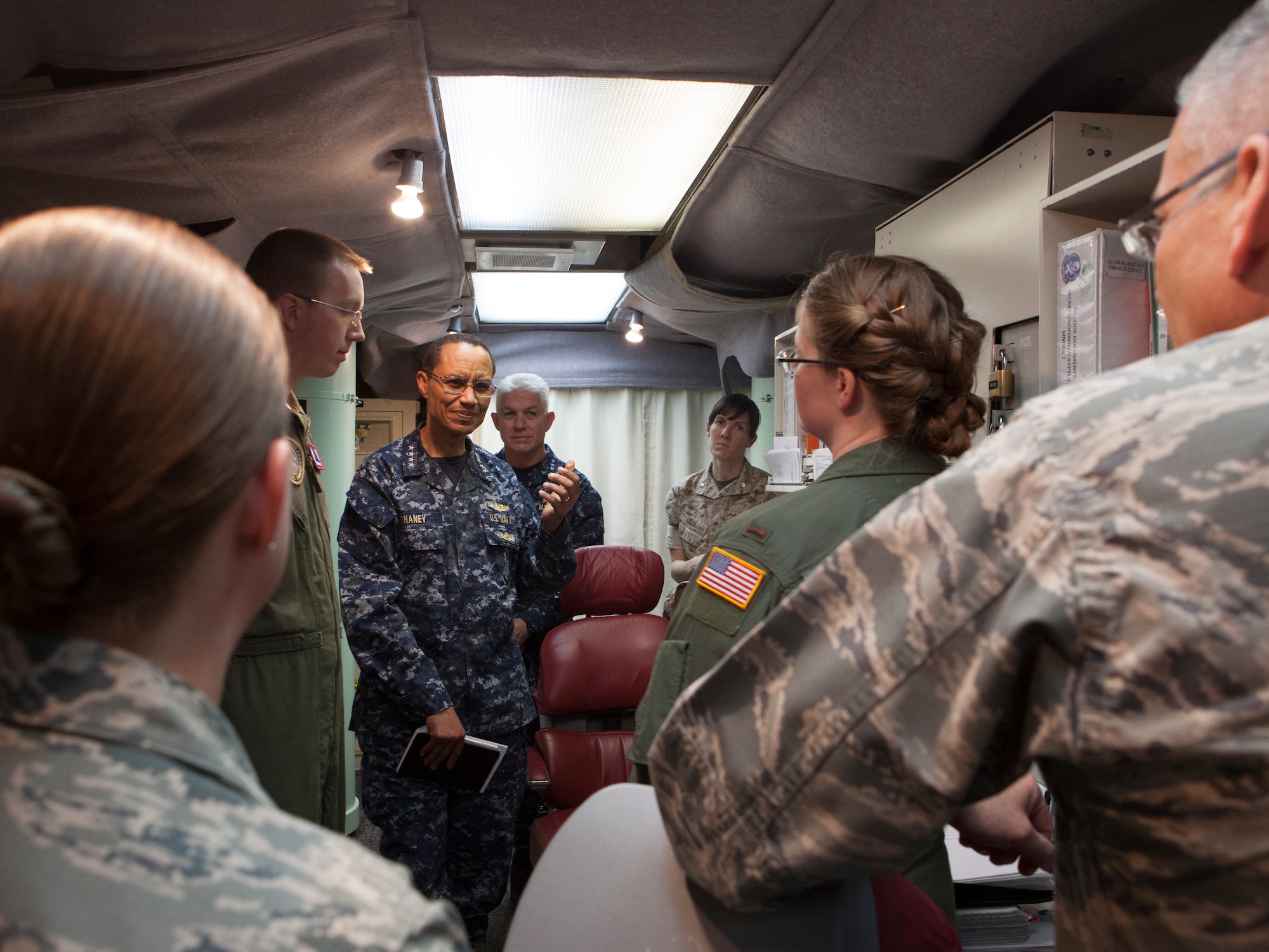U.S. Navy Adm. Cecil D. Haney, U.S. Strategic Command commander, discusses missile operations while at launch control center in Nebraska, during his visit with Airmen from F.E. Warren Air Force Base, Wyo., April 27, 2015. Haney traveled to F.E. Warren to see firsthand the men and women performing the ICBM mission 24/7, 365, and to chair the Intercontinental Ballistic Missile Stakeholders meeting, one of several such meetings that will be held this year. USSTRATCOM is one of nine DoD unified combatant commands and is charged with strategic deterrence; space operations; cyberspace operations; joint electronic warfare; global strike; missile defense; intelligence, surveillance and reconnaissance; combating weapons of mass destruction; and analysis and targeting. (U.S. Air Force photo by Lan Kim)