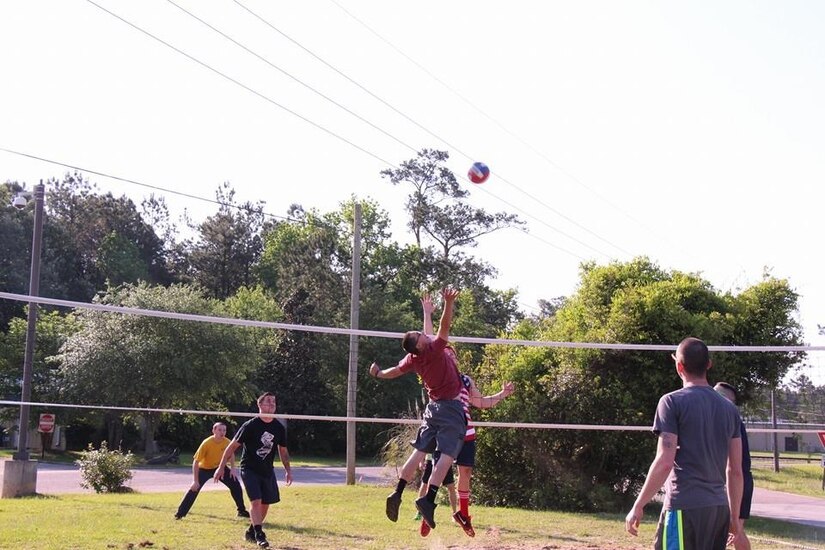 Service members participate in a Volleyball Tournament April 23, 2015 at Joint Base Charleston - Weapons Station, S.C. Naval Munitions Command Charleston hosted the tournament and picnic to help raise awareness for Sexual Assault Awareness and Prevention Month.  The winning team "We Dem Boyz" beat six other teams at NMC Charleston to take the tournament. (Courtesy photo) 

