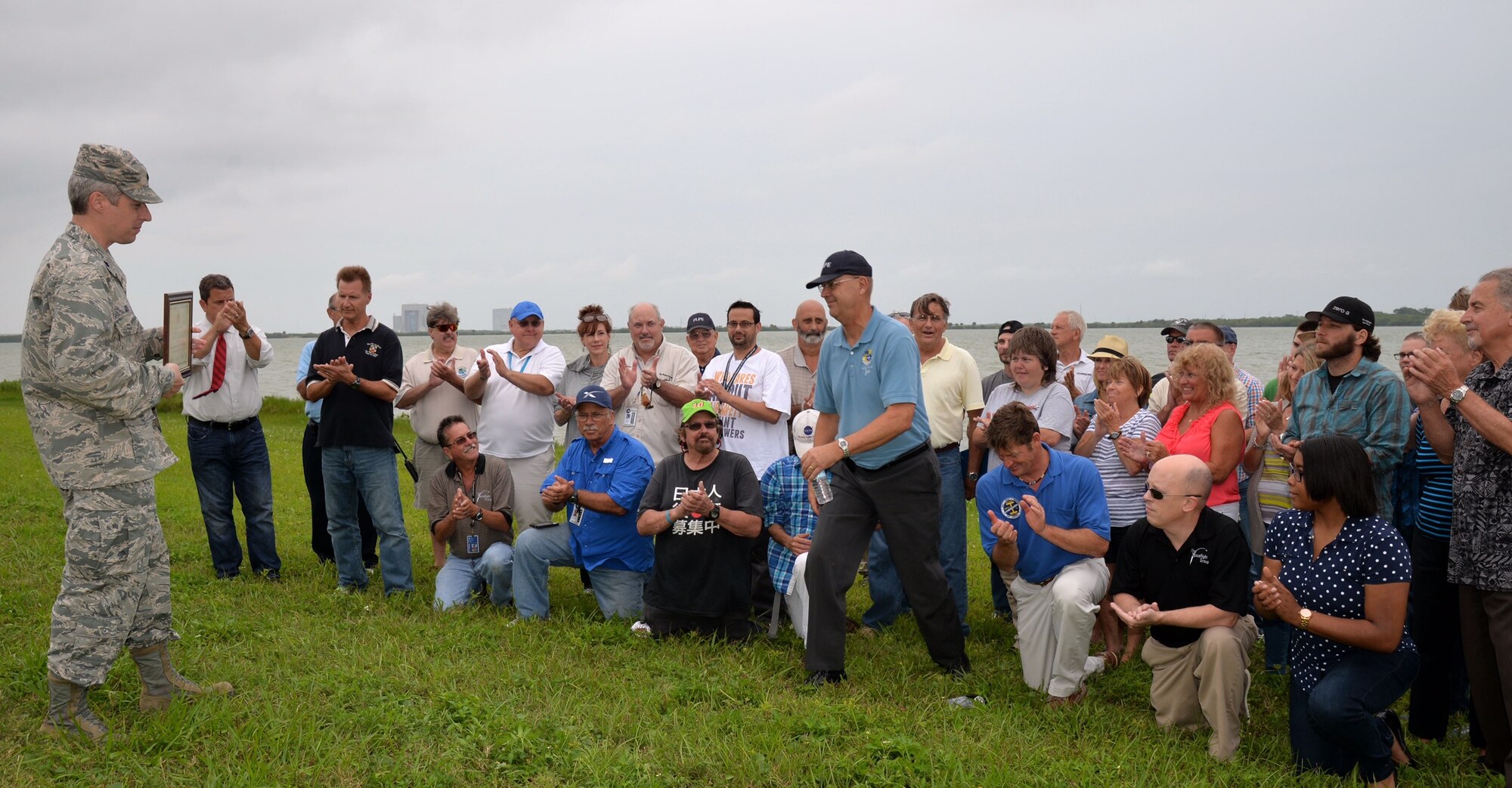 Lt. Col. Anthony Cole, 45th Mission Support Group Detachment 1 commander, presents retired Air Force veteran, Jim Hale, Project Emeritus volunteer, with a certificate of appreciation recognizing more than 1,000 hours of volunteer service to the 45th Space Wing, April 27, 2015, at Cape Canaveral Air Force Station, Fla. Hale volunteers his time escorting media on behalf of Public Affairs and conducts several tours of CCAFS. To become a volunteer, contact Project Emeritus at (321) 494-7656. (Courtesy photo by Julian Leek)  