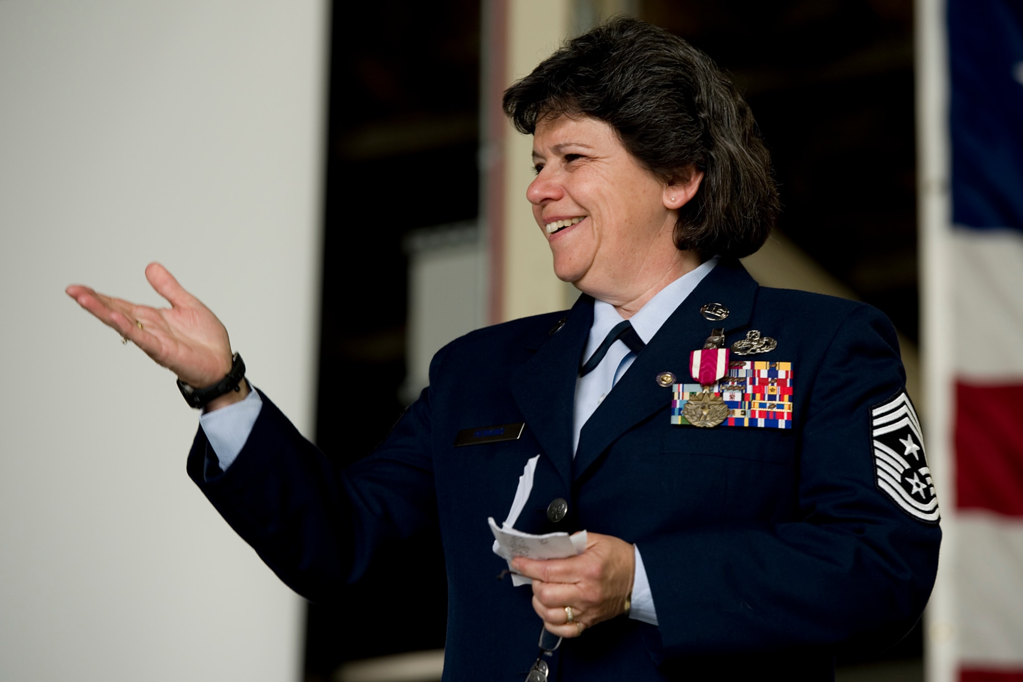 Chief Master Sgt. Karen Perkins, 434th Air Refueling Wing command chief, thanks family and friends for their support of her military career during her retirement ceremony at Grissom Air Reserve Base, Ind., April 12, 2015. Perkins officially retires from the Air Force Reserve May 1, with over 32 years of service. (U.S. Air Force photo/ Senior Airman Jami K. Lancette)