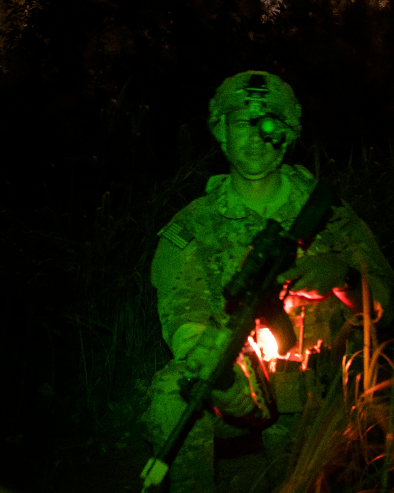 Staff Sgt. Miguel Hill, 482nd Civil Engineering Squadron Explosive Ordnance Disposal Flight team member, performs rear guard duty during night operations at Homestead Air Reserve Base, Fla., April 8. The EOD Flight conducted dismounted counter-IED operations as part of a weeklong training exercise aimed to prepare the reservists for combat operations. (U.S. Air Force photo by Staff Sgt. Jaimi L. Upthegrove)