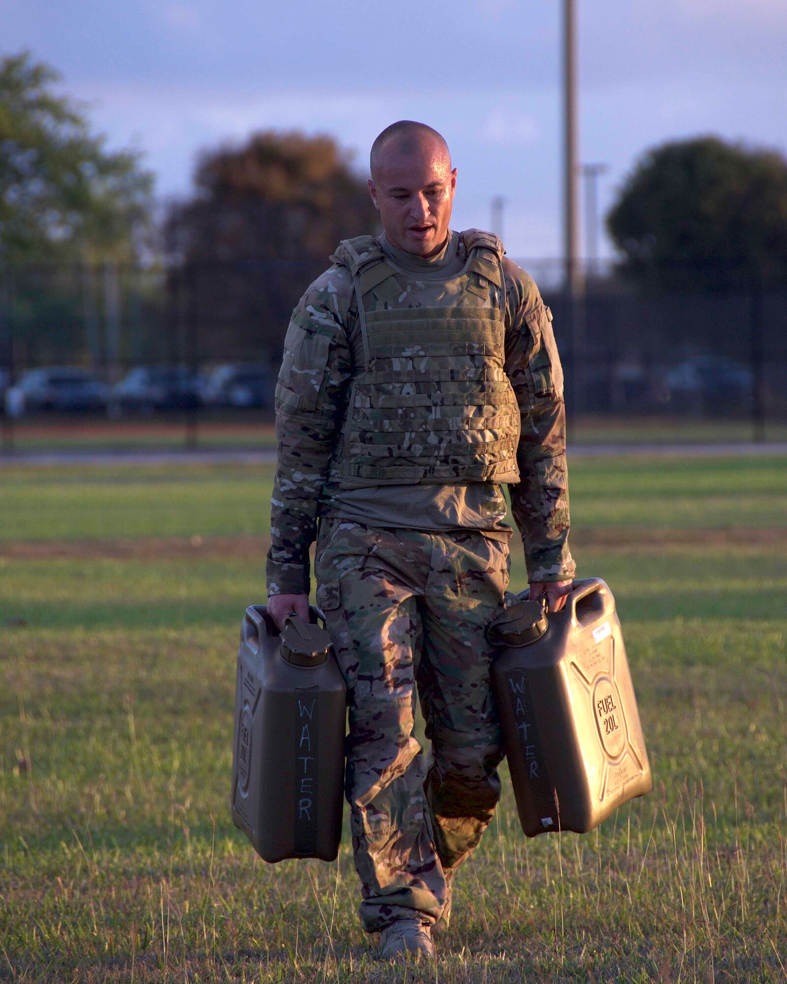 Senior Master Sgt. William Williams, 482nd Civil Engineering Squadron Explosive Ordnance Disposal Flight program manager, carries approximately 80 pounds of water 100 meters during a Task Oriented Physical Exercise at Homestead Air Reserve Base, Fla., April 6. The TOPE was conducted during a weeklong training exercise aimed to prepare the reservists for combat operations. (U.S. Air Force photo by Staff Sgt. Jaimi L. Upthegrove)