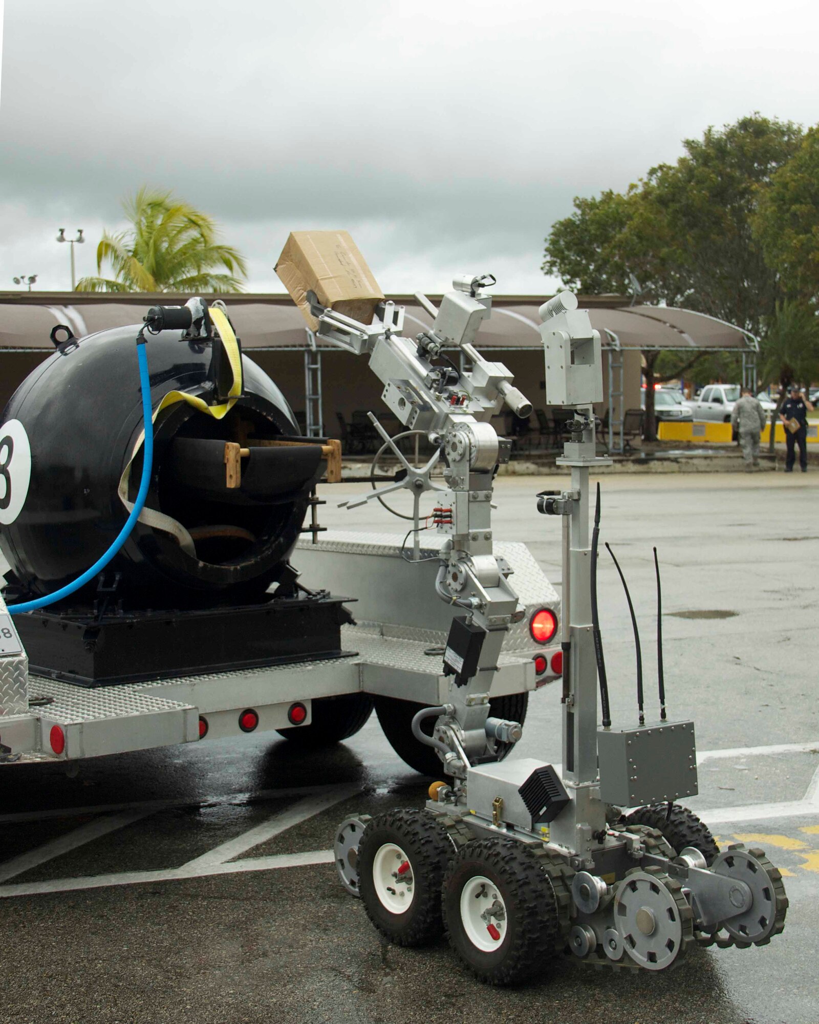 An F-6A robot places the improvised explosive device in a bomb containment vessel during a suspect package exercise conducted by the 482nd Civil Engineering Squadron Explosive Ordnance Flight at Homestead Air Reserve Base, Fla., Feb. 18. The BCV is used to safely transport non-fragmenting devices until they can be disposed of in a controlled manner. (U.S. Air Force photo by Staff Sgt. Jaimi L. Upthegrove)