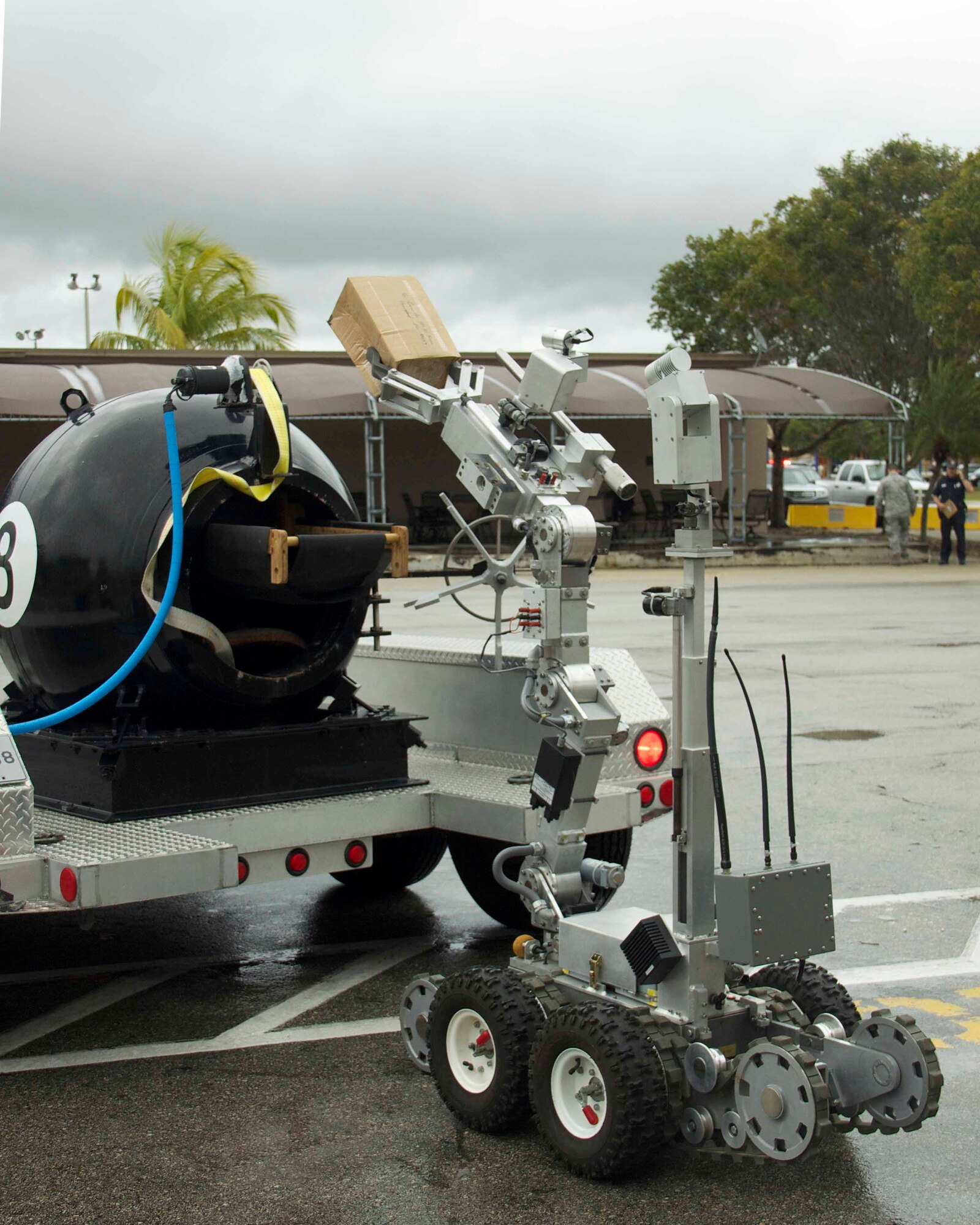 An F-6A robot places the improvised explosive device in a bomb containment vessel during a suspect package exercise conducted by the 482nd Civil Engineering Squadron Explosive Ordnance Flight at Homestead Air Reserve Base, Fla., Feb. 18. The BCV is used to safely transport non-fragmenting devices until they can be disposed of in a controlled manner. (U.S. Air Force photo by Staff Sgt. Jaimi L. Upthegrove)