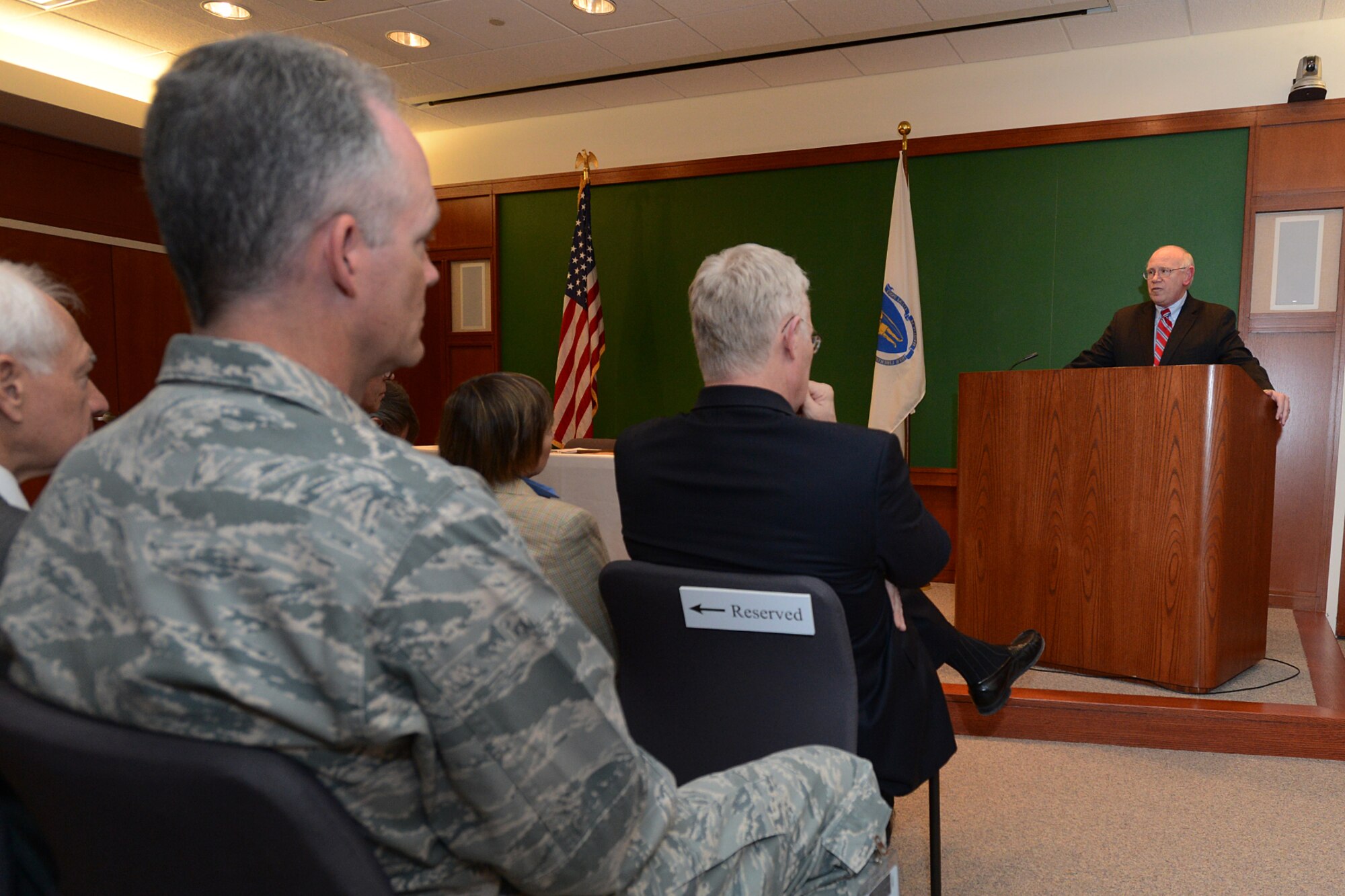 Richard W. Lombardi, deputy assistant secretary of the Air Force for Acquisition, speaks at a podium prior to officials from the U.S. Air Force and Massachusetts Institute of Technology Lincoln Laboratory signing a 10-year contracting agreement during a ceremony at MIT LL April 28. The contract authorizes the lab to conduct national security-based research and development for the Department of Defense and other U.S. government agencies. (U.S. Air Force photo by Jerry Saslav)