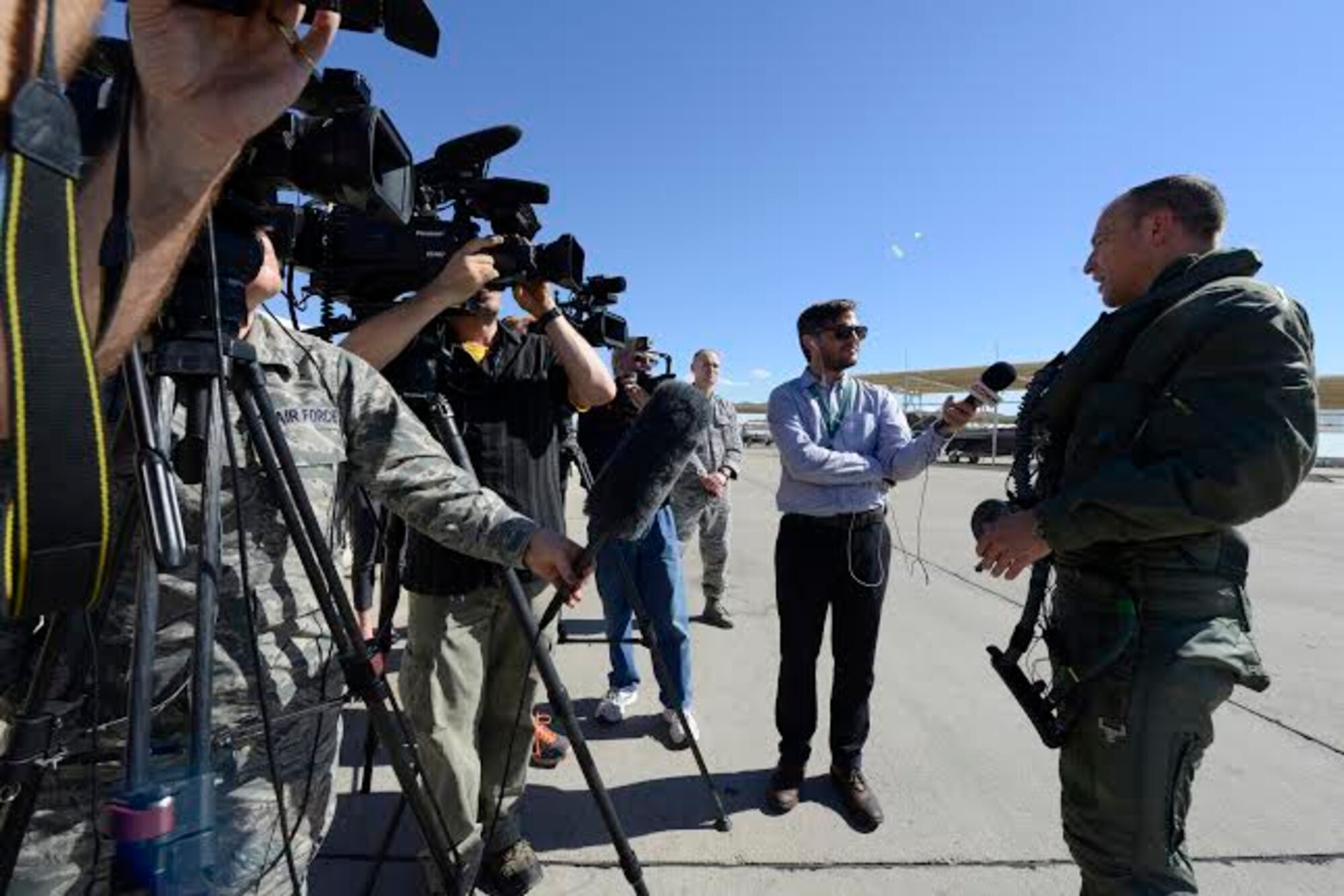 Brig. Gen. Scott Pleus, 56th Fighter Wing commander, speaks with U.K. and Arizona-based media outlets after landing the flagship F-35 Lightning ll at Luke Air Force Base, Arizona, April 28, 2015. The flagship's arrival coincides with the start of Luke F-35 student pilot training, which begins in May. Luke now has 20 U.S. F-35s and two from the Royal Australian Air Force. (U.S. Air Force photo by Senior Airman Devante Williams)