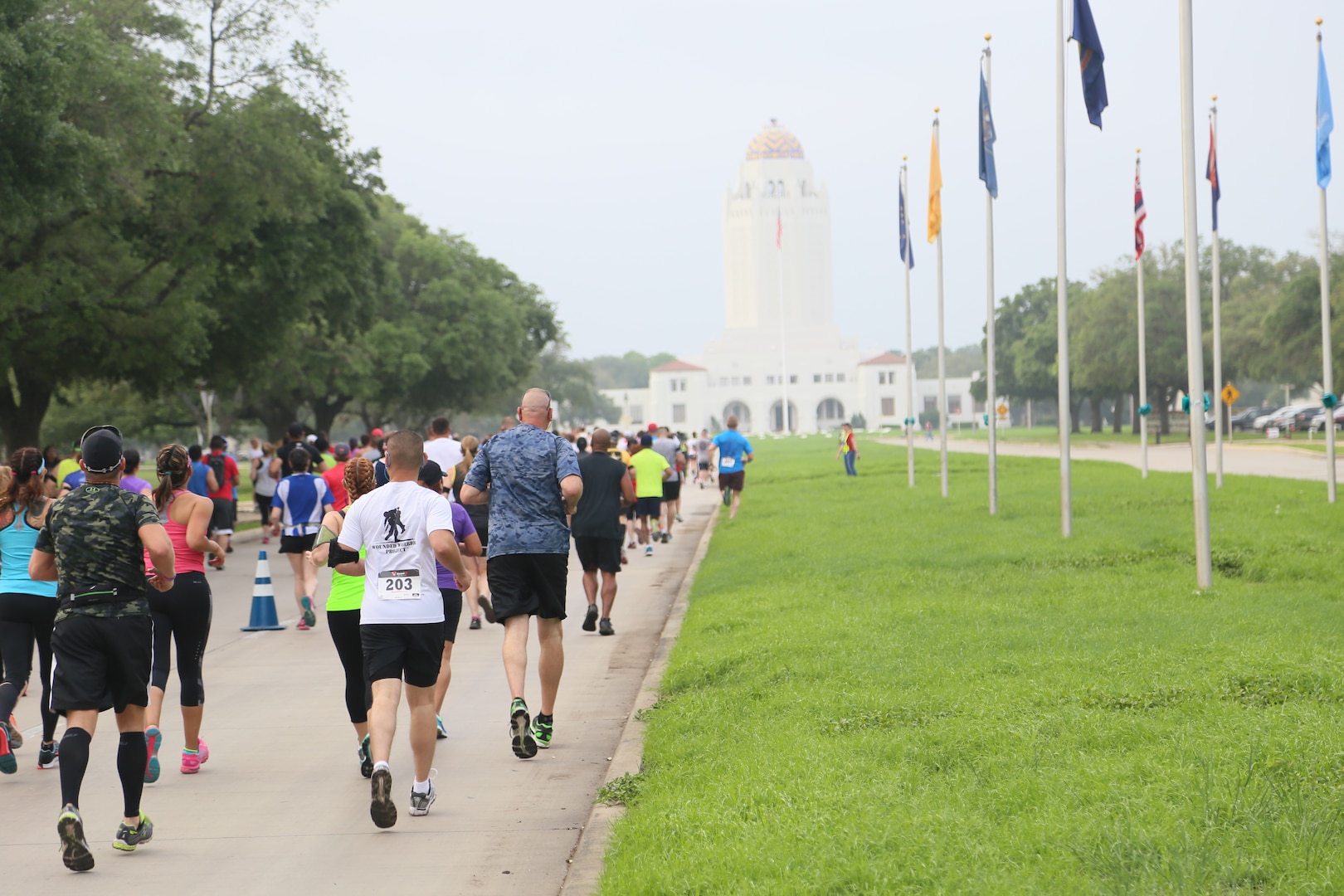 Joint Base San Antonio members run down Harmon Drive April 26 during the start of the JBSA Half Marathon at JBSA-Randolph. In its second year, the race not only provided an opportunity for members from all JBSA locations to tour the scenic route and rich history of JBSA-Randolph, but to experience camaraderie and teamwork between runners and volunteers alike throughout the event. (U.S. Air Force photo by Airman 1st Class Alexandria Slade)
