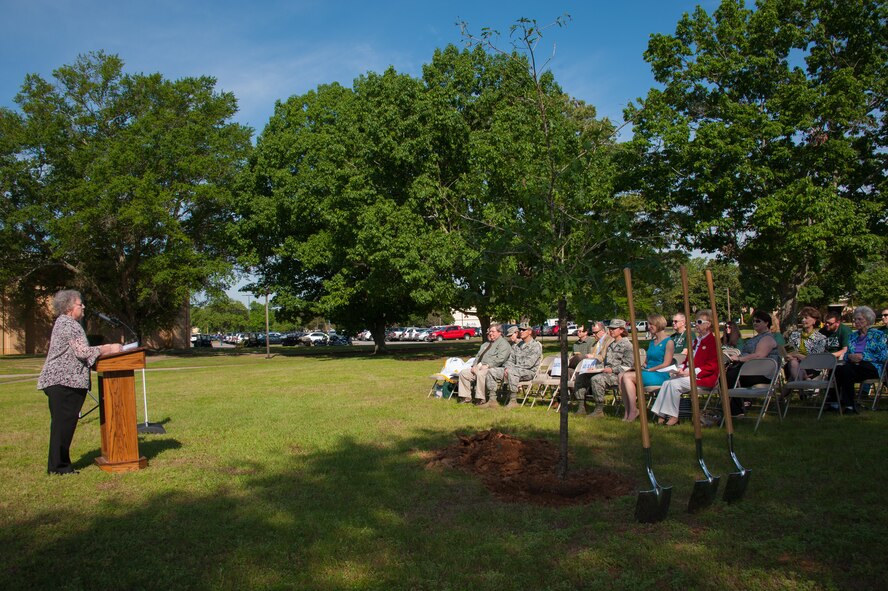 Linda Davis, Camellia Garden Club secretary and treasurer, shares the history of Arbor Day and the significance it holds during the annual Arbor Day Ceremony, April 23, 2015, Maxwell Air Force Base, Alabama. The Camellia Garden Club not only helped to develop the newly formed Maxwell Roses Garden Club but provides guidance to the club as well. (U.S. Air Force photo by Melanie Rodgers Cox/Cleared)