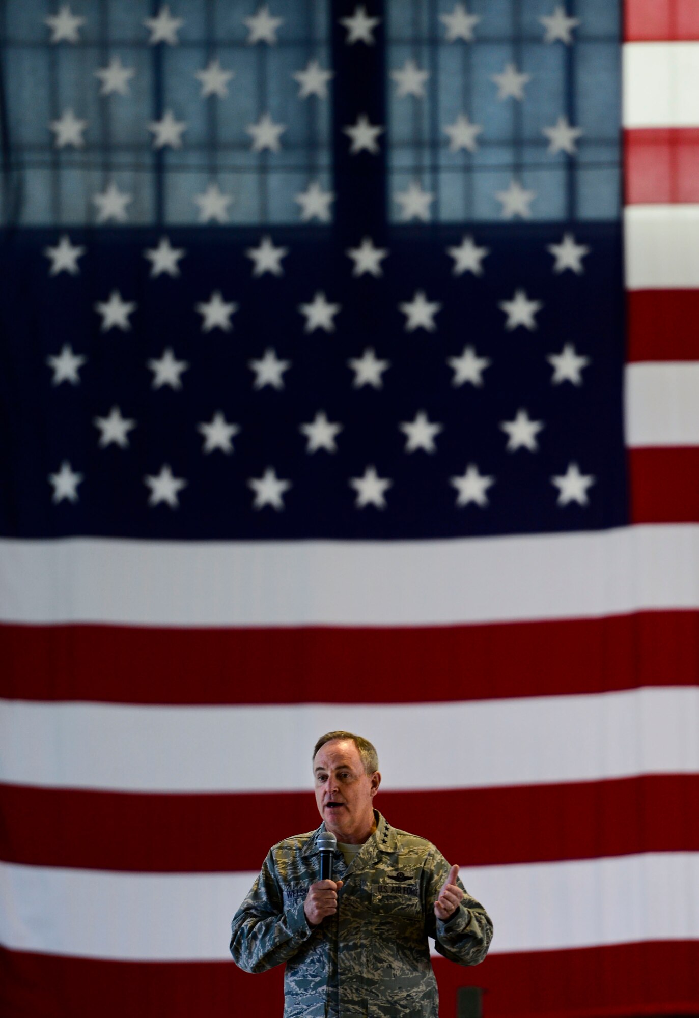 Chief of Staff of the U.S. Air Force, Gen. Mark A. Welsh III, addresses Service members during an all call held at Langley Air Force Base, Va., April 28, 2015. Welsh and his wife, Betty, conducted a base tour of Langley as an opportunity to complete a comprehensive assessment of Air Force needs, requirements and investments. (U.S. Air Force photo by Senior Airman Kayla Newman/Released)