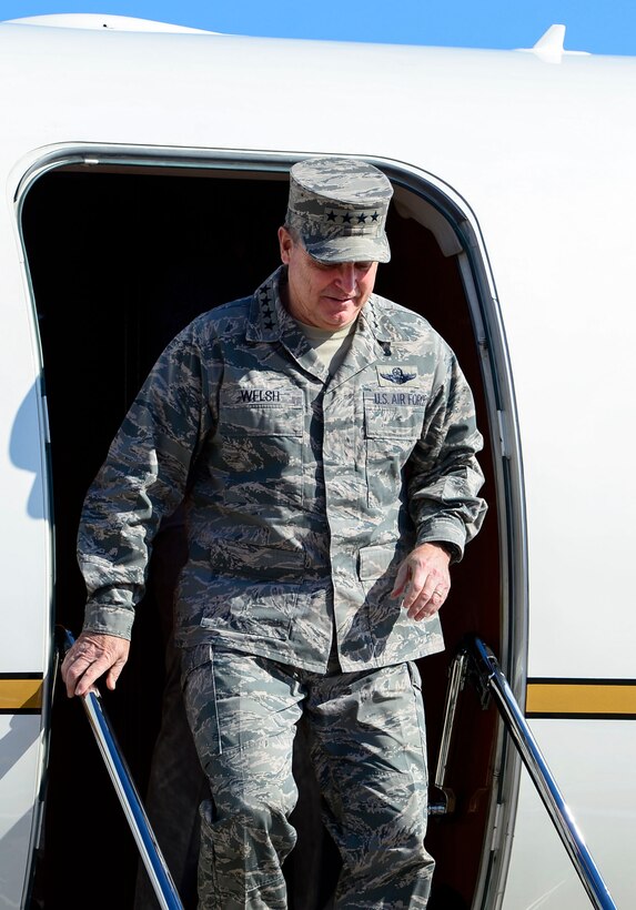U.S. Air Force Chief of Staff of Gen. Mark A. Welsh III, exits his aircraft at Langley Air Force Base, Va., April 27, 2015. Welsh, accompanied by his wife, Betty, conducted a three-day tour of Langley. (U.S. Air Force photo by Senior Airman Kayla Newman/Released)	