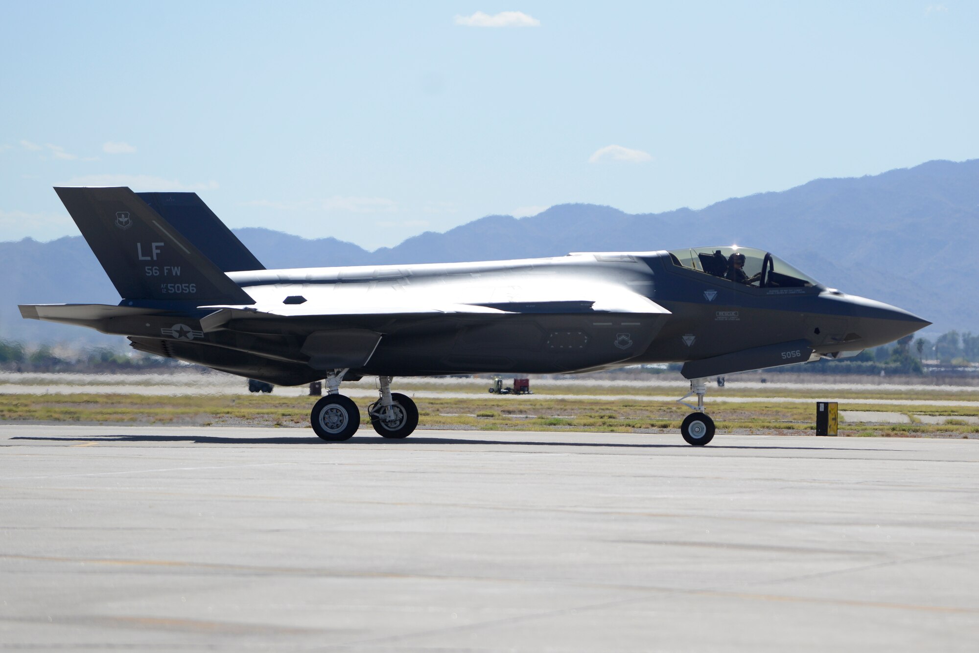 Brig. Gen. Scott Pleus, 56th Fighter Wing commander, lands the flagship F-35 Lightning ll at Luke Air Force Base, Arizona, April 28, 2015. The flagship's arrival coincides with the start of Luke F-35 student pilot training, which begins in May. Luke now has 20 U.S. F-35s and two from the Royal Australian Air Force. (U.S. Air Force photo by Senior Airman Devante Williams)