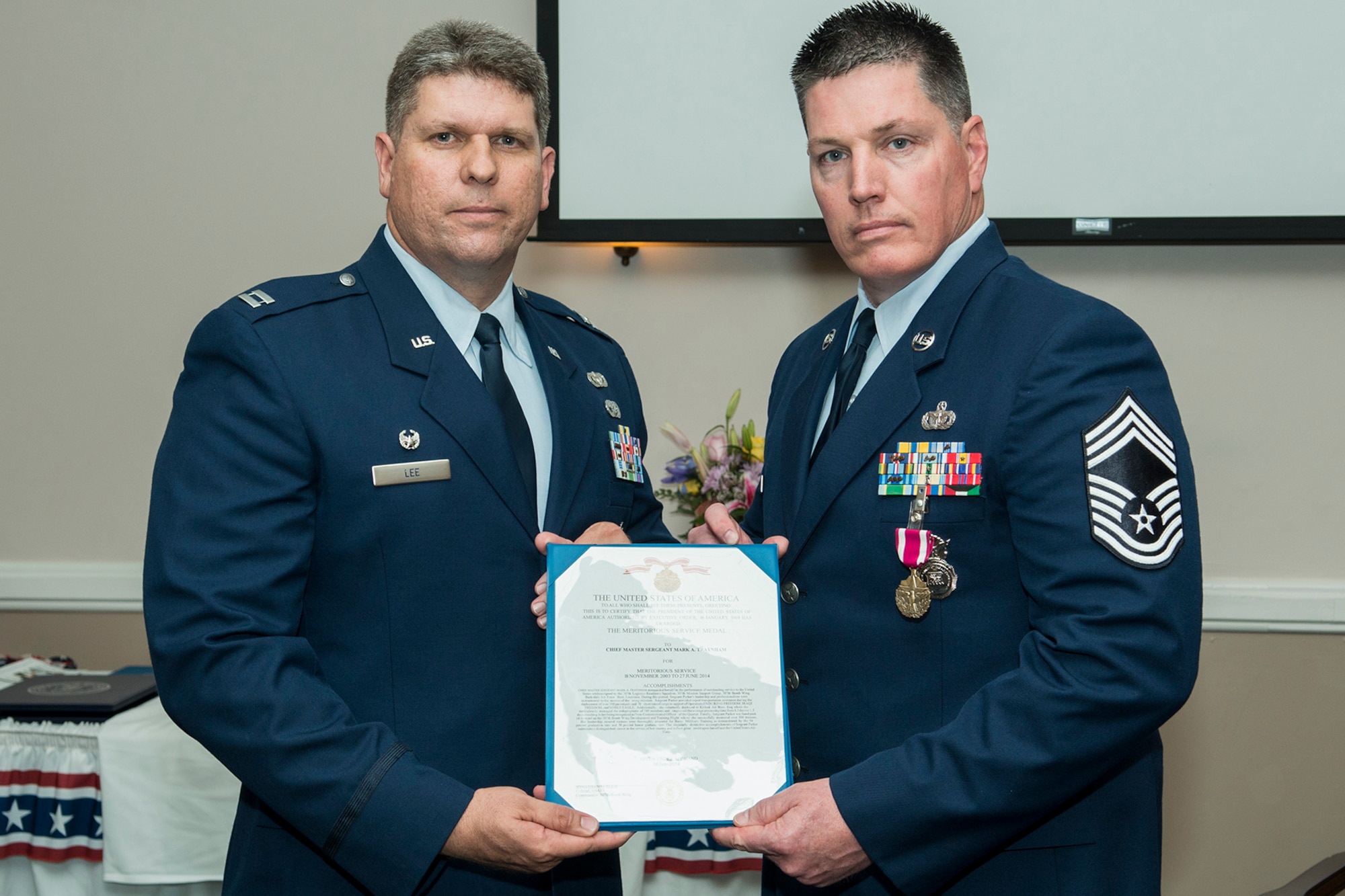 U.S. Air Force Chief Master Sgt. Mark Traynham is awarded the Air Force Meritorious Service Medal during his retirement ceremony on April 25, 2015, Barksdale Air Force Base, La. Traynham received the medal for distinguished performance of outstanding service to the United States while assigned to the 307th Security Forces Squadron at Barksdale. (U.S. Air Force photo by Master Sgt. Greg Steele/Released)