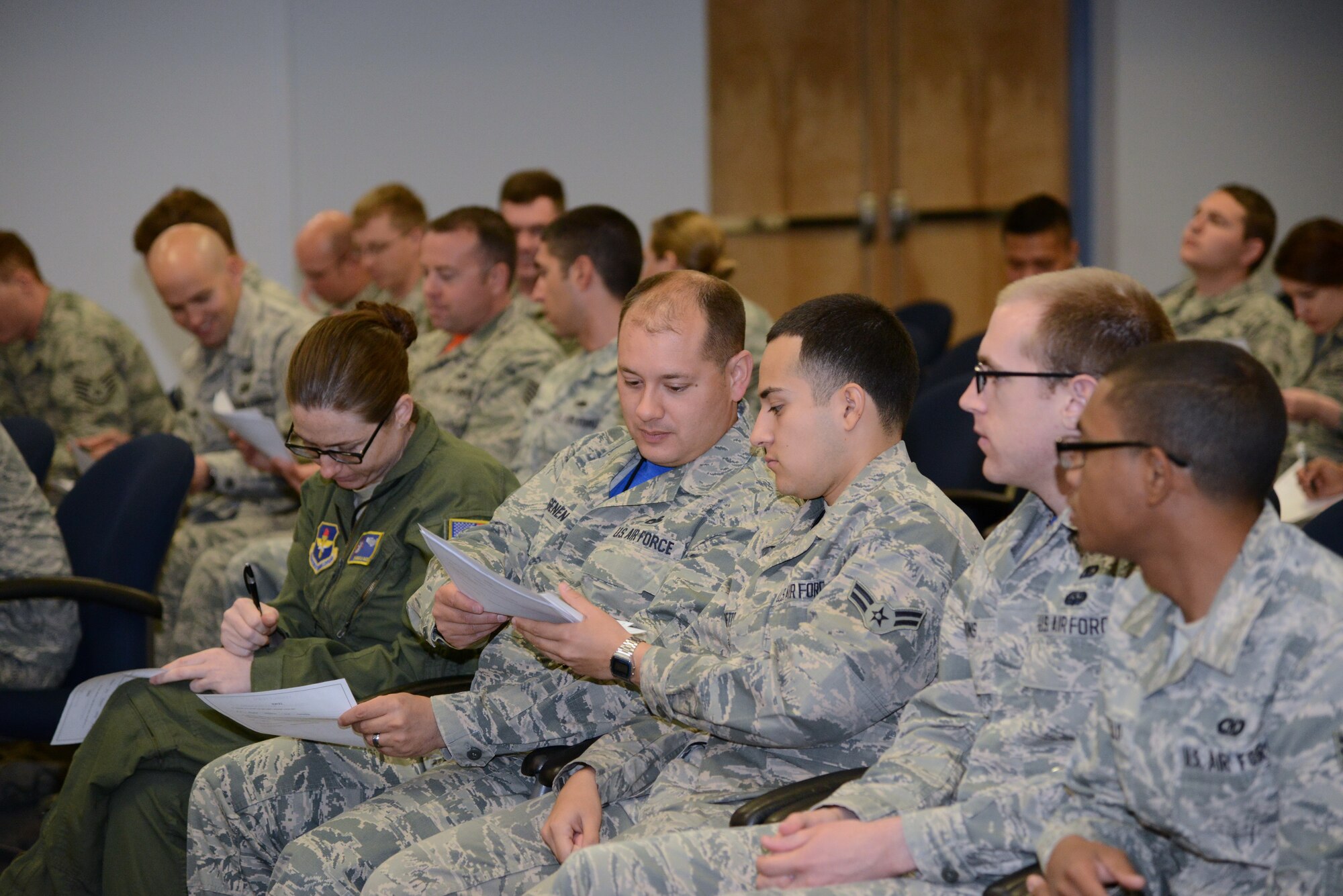 Airmen "deliberate" on a verdict at a mock trial April 17 at the Phillips Laboratory building. The mock trial was held as part of a Sexual Assault Awareness and Prevention Month series. About 150 Airmen turned out to serve as members of the mock panel deciding the fate of the accused. (Photo by Jamie Burnett)