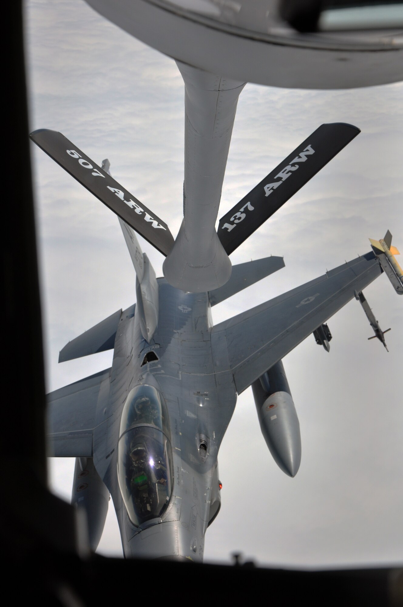 A KC-135 Stratotanker, assigned to the 507th Air Refueling Wing at Tinker Air Force Base, Okla., refuels an F-16 Fighting Falcon assigned to the 510th Fighter Squadron, April 28, 2015, over the Mediterranean Sea. More than 50 Air Force Reservists, including chaplains, crew chiefs and force support worked with Aviano units during their two-week annual tour.  (U.S. Air Force photo by Airman First Class Chandler Baker/Released)