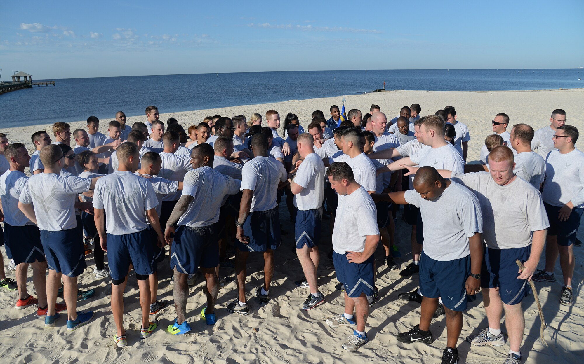 Members of Team Keesler wind up the 85th Engineering Installation Squadron’s physical training event at the beach, April 22, 2015, Biloxi, Miss. While hosting the event, the 85th EIS invited other Keesler members to participate in the 90-minute PT session consisting of a 1.5-mile run and different stations for aerobic exercises. (U.S. Air Force photo by Senior Airman Holly Mansfield)