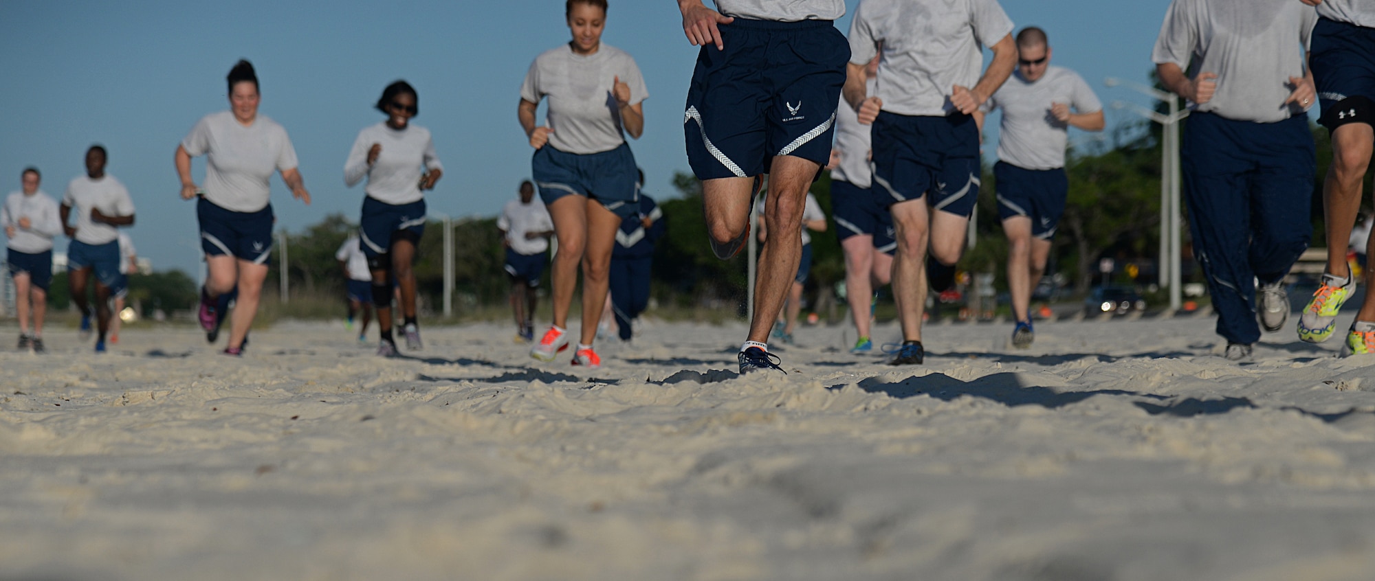 Keesler members run to different aerobic stations during the 85th Engineering Installation Squadron’s physical training event at the beach, April 22, 2015, Biloxi, Miss. The 85th EIS invited other Keesler units to participate in the 90-minute PT session which also included a 1.5 mile run. (U.S. Air Force photo by Senior Airman Holly Mansfield)