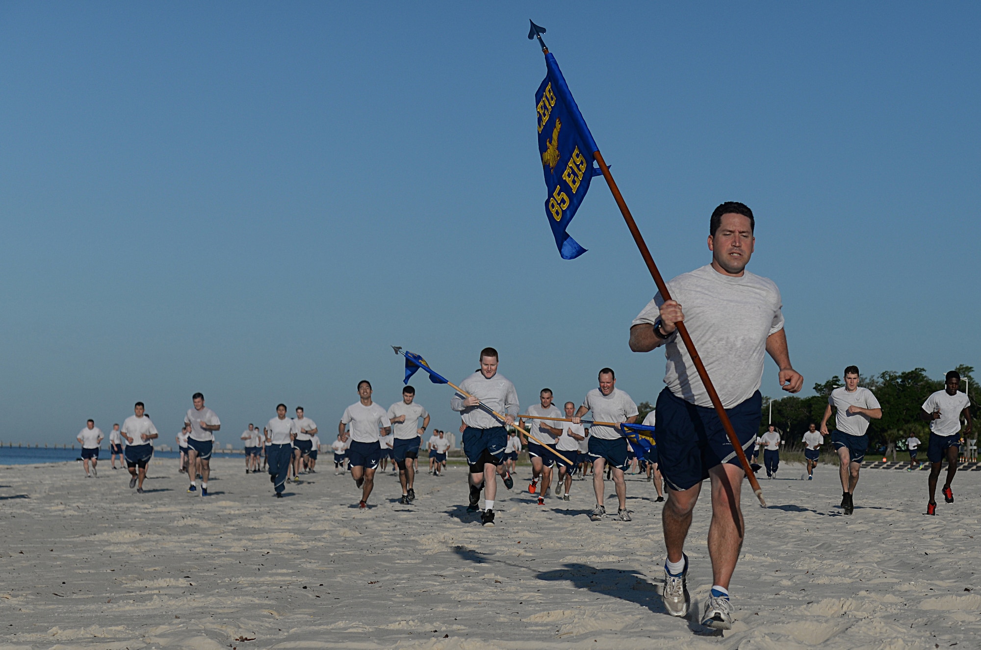 Keesler members run to different aerobic stations during the 85th Engineering Installation Squadron’s physical training event at the beach, April 22, 2015, Biloxi, Miss. The 85th EIS invited other Keesler units to participate in the 90-minute PT session which also included a 1.5 mile run. (U.S. Air Force photo by Senior Airman Holly Mansfield)