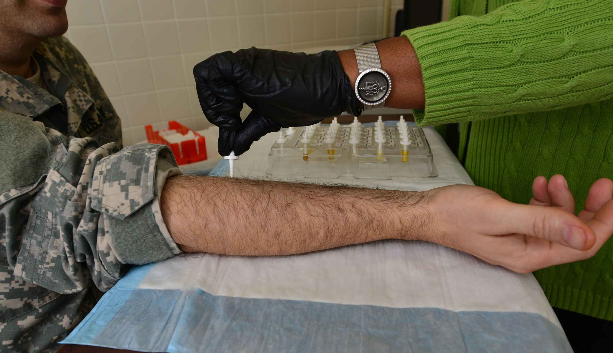 Valerie Hicks, McDonald Army Health Center licensed practical nurse, administers an allergy skin test April 27, 2014, at Fort Eustis, Va. Joint Base Langley-Eustis provides allergy care at both the U.S. Air Force Hospital Langley and the MAHC. In order for patients to get an allergy test, they must first get a consultation from their primary care manager. (U.S. Air Force photo by Staff Sgt. Natasha Stannard/Released.)
