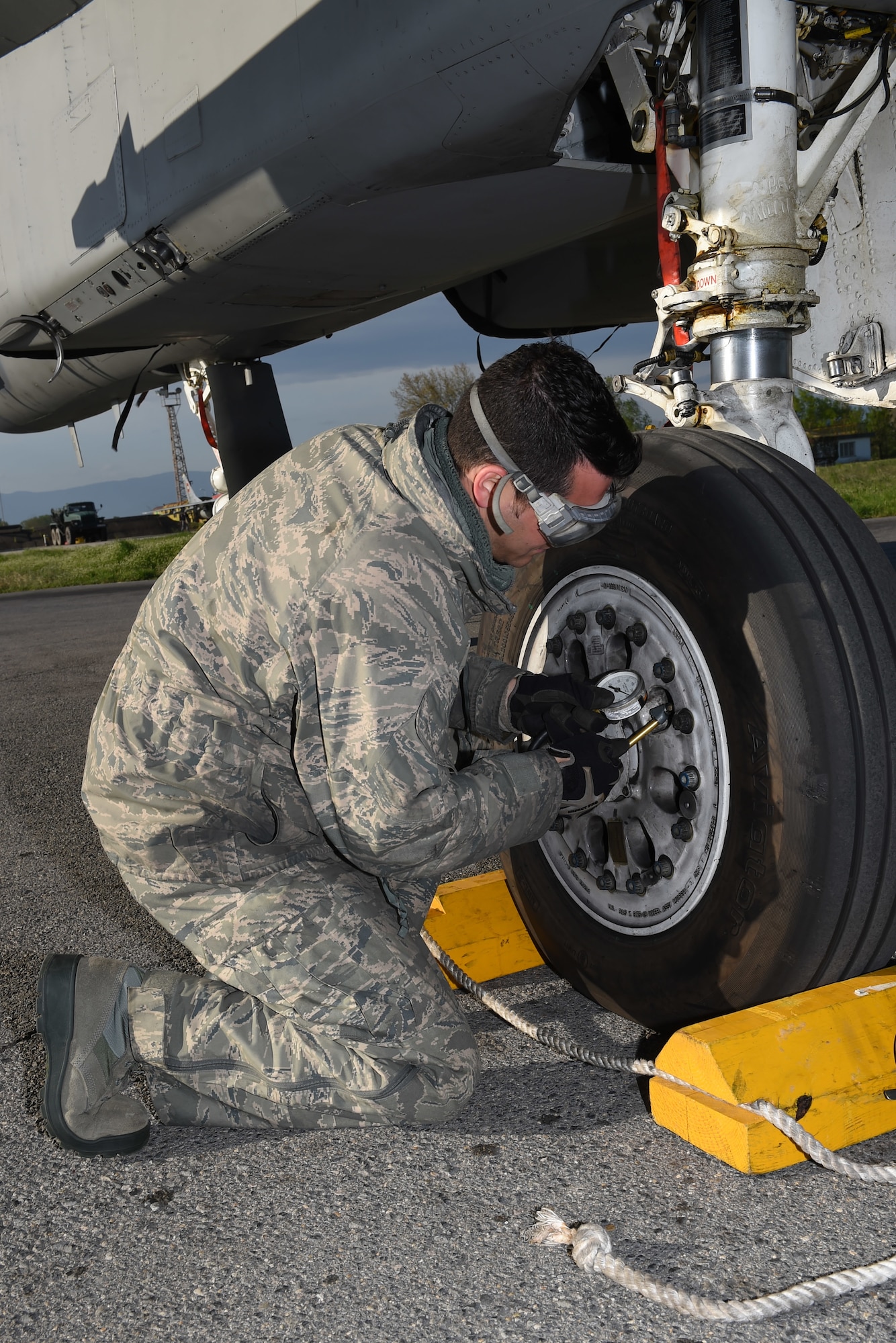 Technical Sgt. Josh Bravo, F-15 crew chief, 159th Aircraft Maintenance Squadron, Louisiana Air National Guard, checks the rear tire pressure of an F-15C Eagle tire during a preflight inspection, April 22, 2015, Graf Ignatievo Air Base, near Plovdiv, Bulgaria. Thracian Eagle 2015 is intended to enhance interoperability with Bulgaria and maintain joint readiness with NATO allies. (U.S. Air National Guard photo by Master Sgt. Toby M. Valadie, 159th Public Affairs Office/RELEASED)