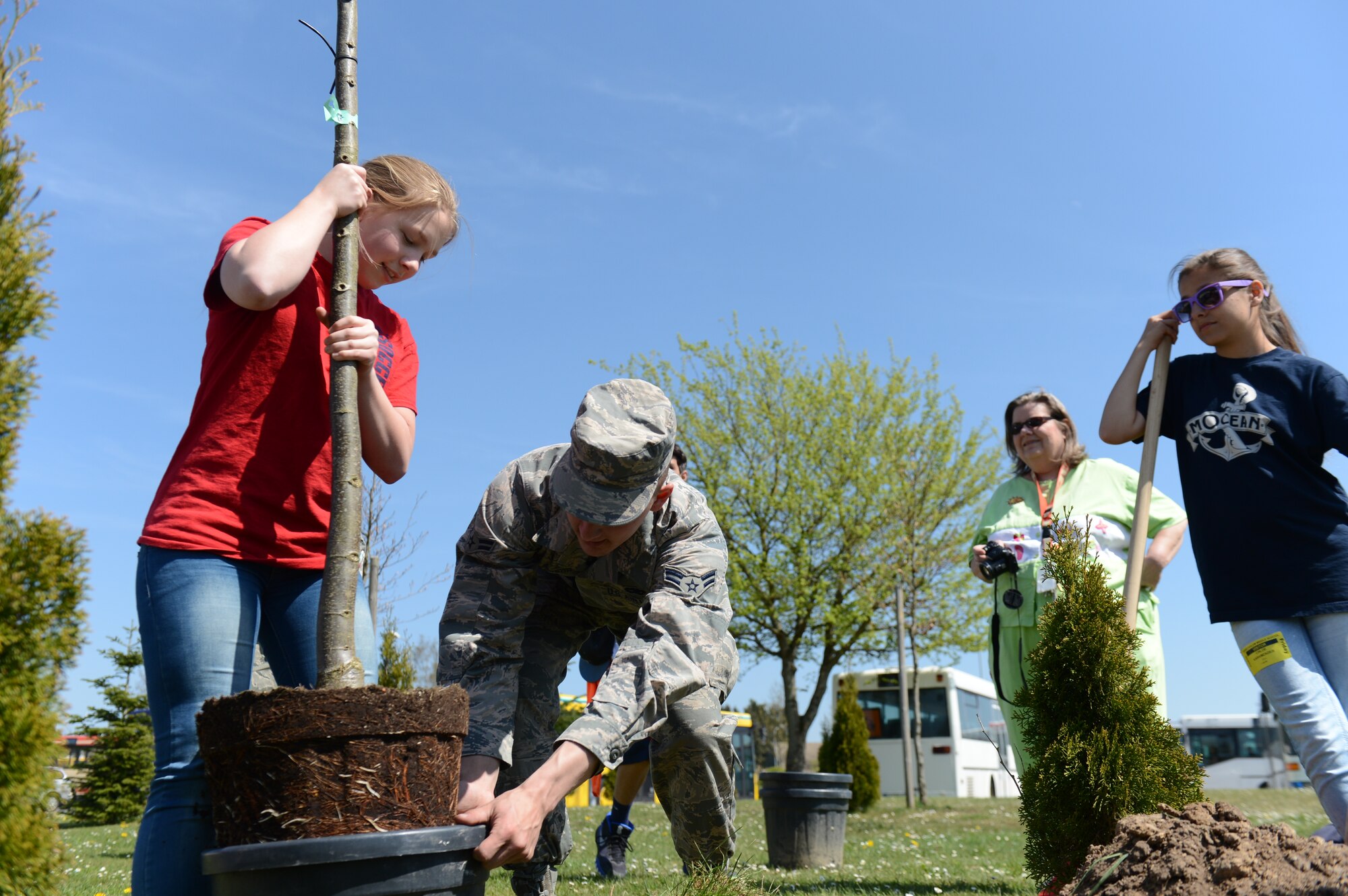 Students from Spangdahlem Middle School and local girl scouts took part in the annual Earth Week tree planting at Spangdahlem Air Base, Germany, April 24, 2015. Four trees were planted this year as part of the environmental awareness event. (U.S. Air force photo by Senior Airman Sarah Denewellis/Released)  