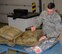 Staff Sgt. Joseph Rossilli, 51st Medical Support Squadron, packs a first-aid kit April 17, 2015, at Osan Air Base Republic of Korea. Rossilli was chosen as a Team Osan Spotlight award winner. Individuals who are chosen for this spotlight recognition are distinguished as consistent, superior performers within their squadrons. (U.S. Air Force photo by Staff Sgt. Benjamin Sutton/Released)